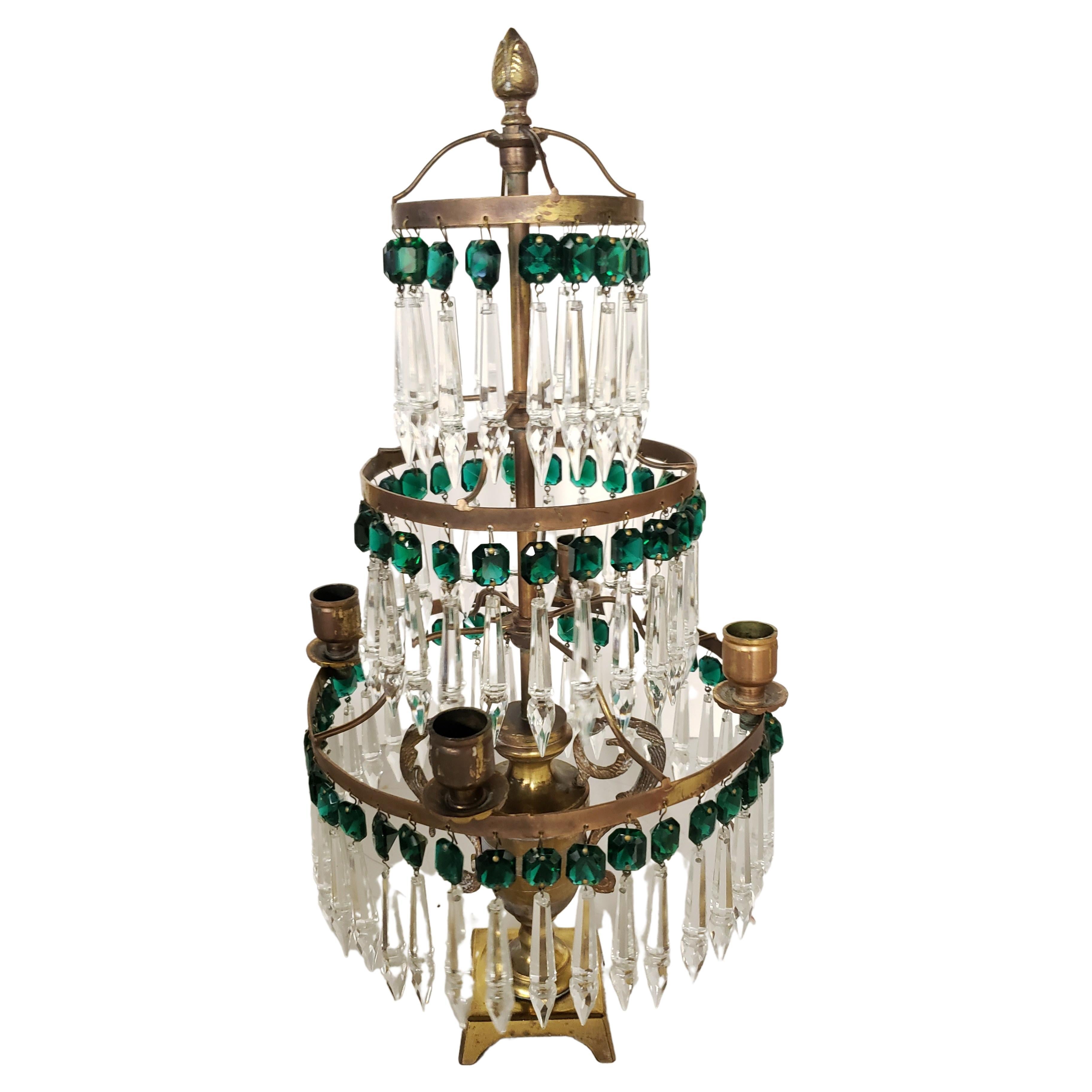 A exquisite 4-arm Solid Brass and various green and crystal clear Crystal pendants Mounted Lustre Candelabra. 
May be used as a centerpiece, on top of sideboard or side table or lamp table. 
Measures 10 inches wide, 10 inches in depth and stands