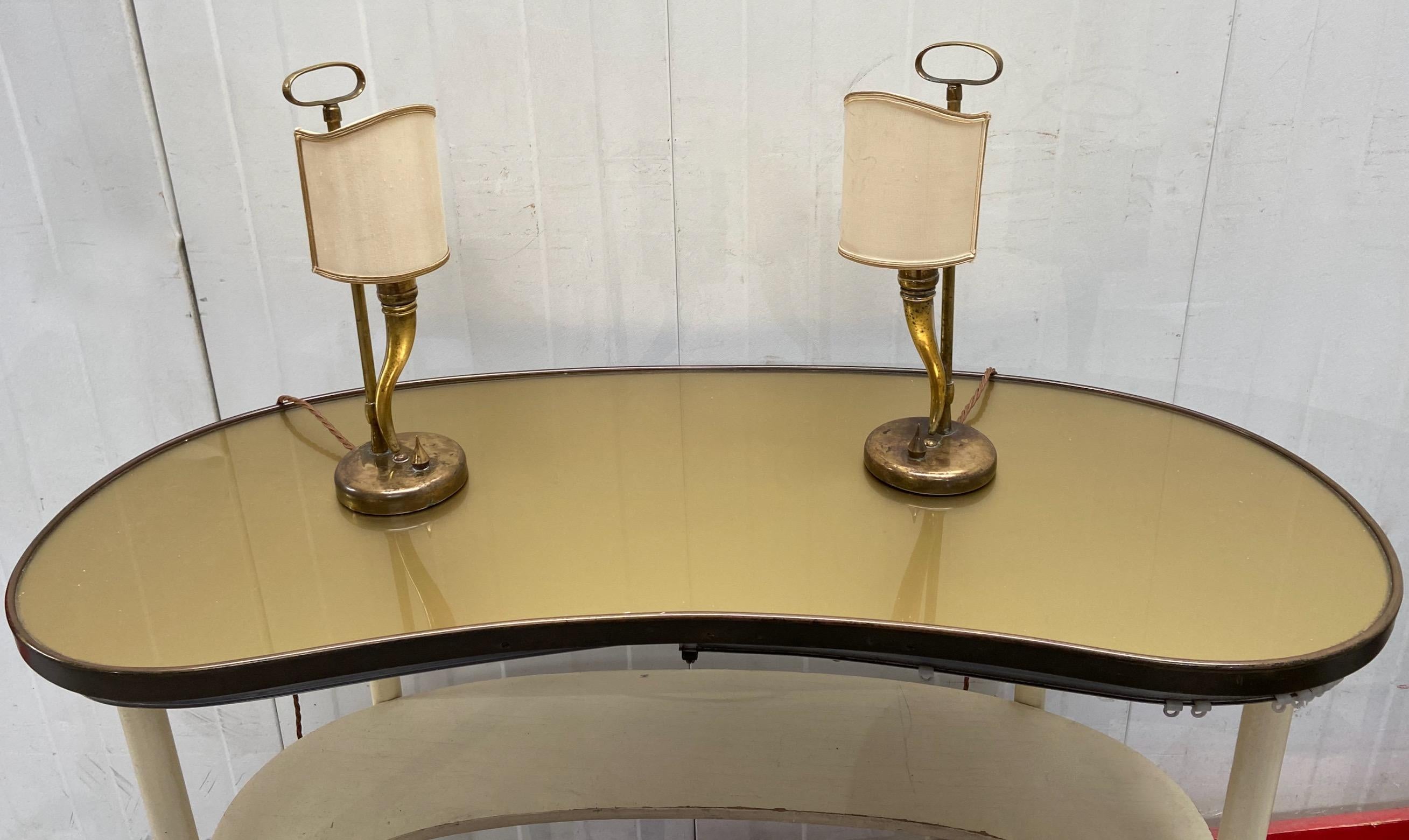 A very elegant pair of 1940's to 1950's brass table lamps, attributed to, and most probably by, Gio Ponti and Emilio Lancia. 
They could be polished if needed but we prefer them as found.
Please note that our handling time is usually shorter than