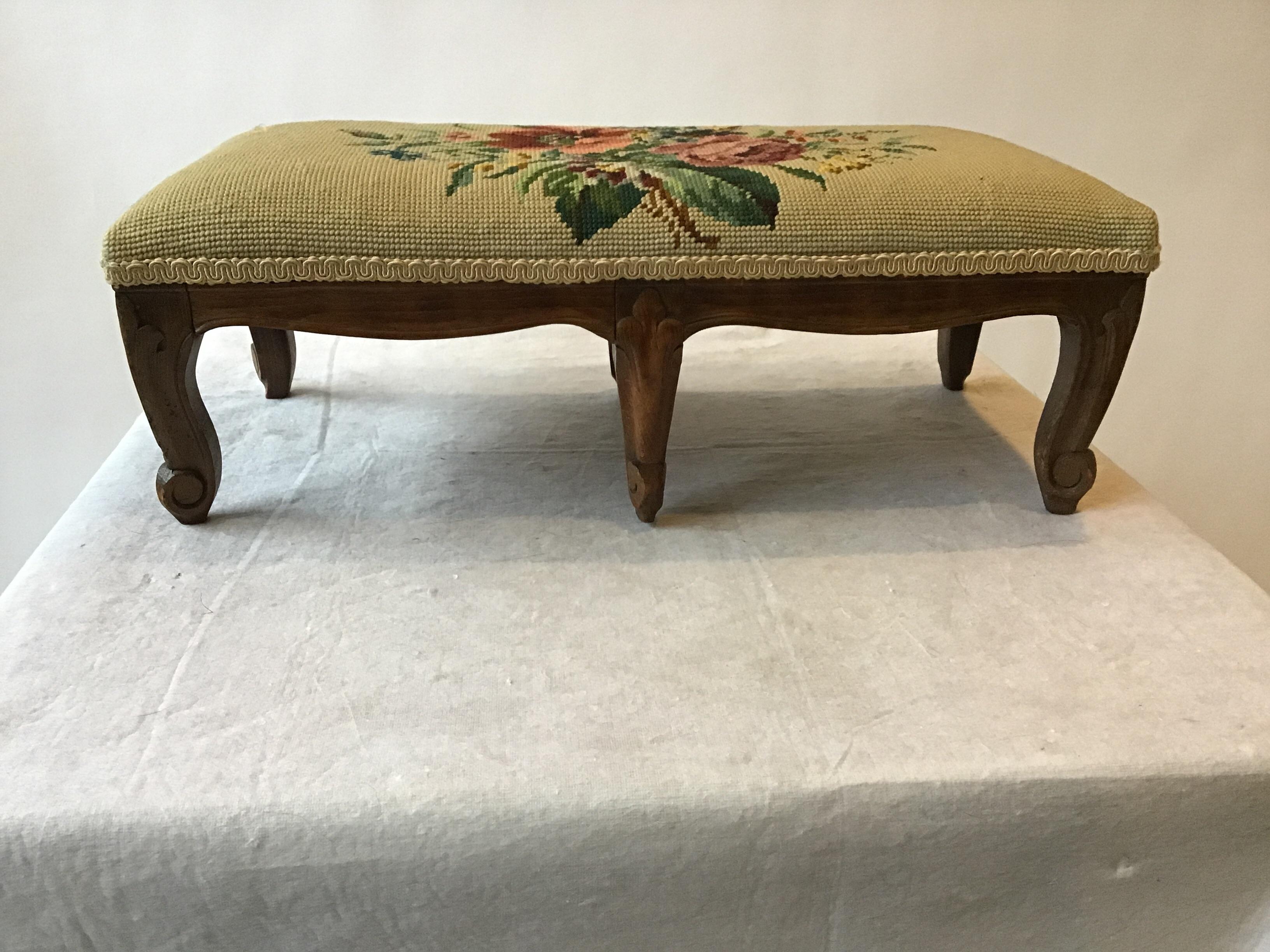 1940s 6 leg footstool. Needlepoint top. Marked made in Belgium.