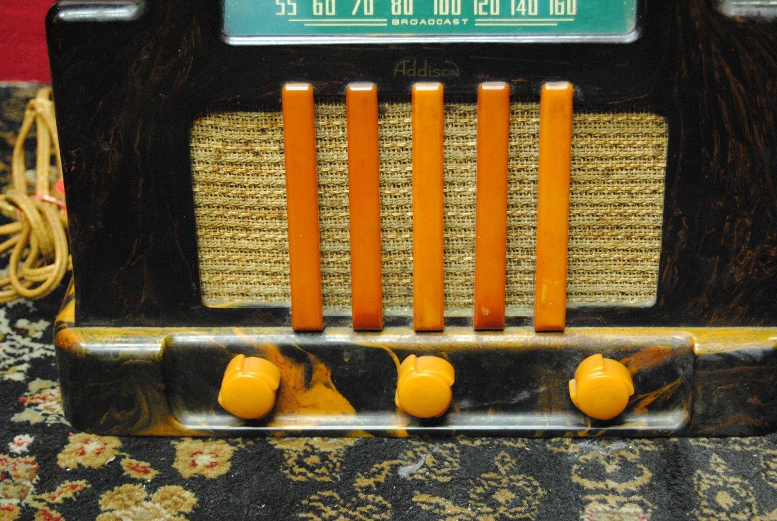 This vintage tabletop Catalin Radio, circa 1940, by Addison Industries, Ltd. Canada. Catalin (a brand name for a thermosetting polymer popular in the 1930s and 1940s - a phenol formaldehyde resin - like bakelite, but a two-stage process with a lot