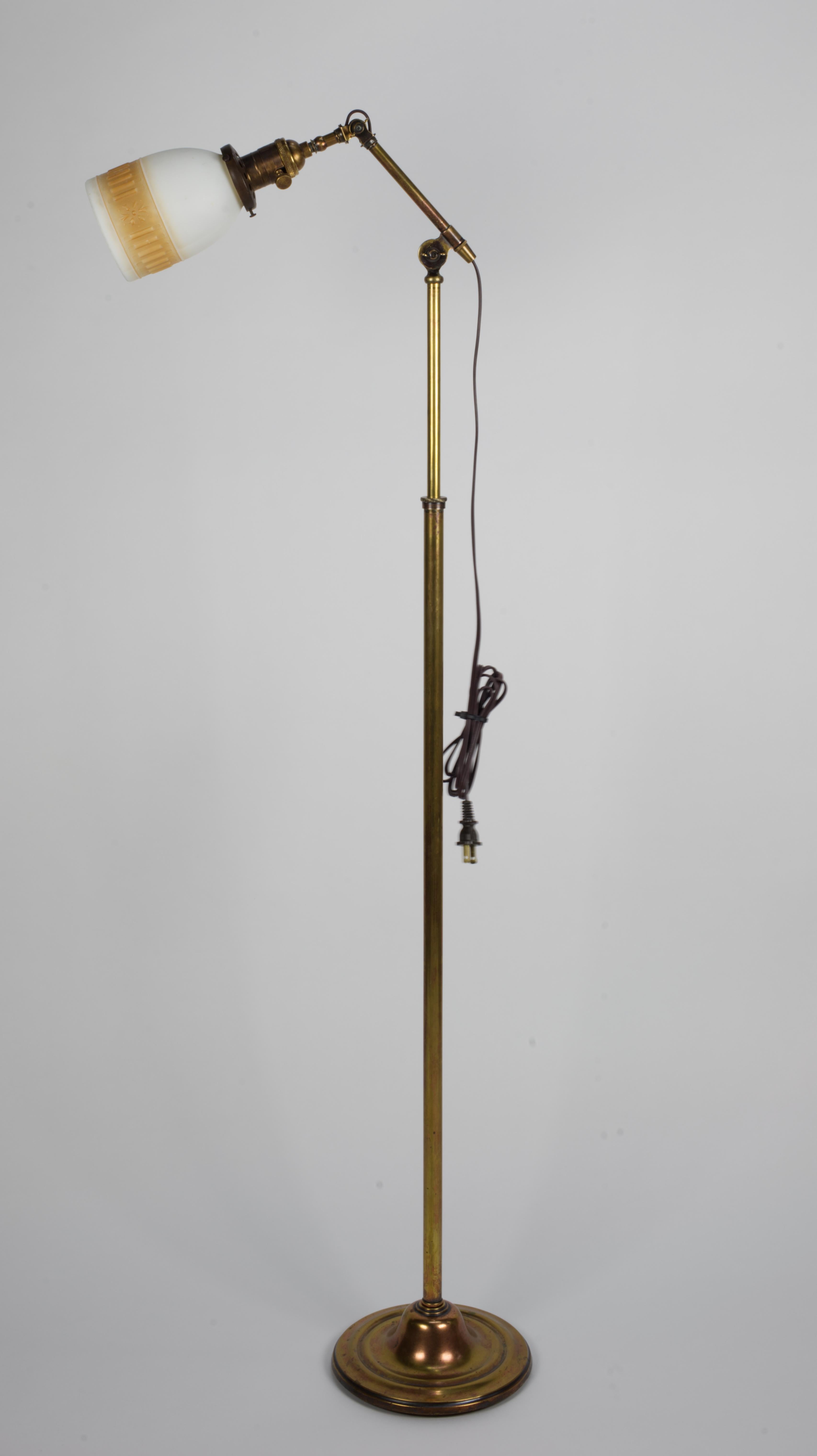 Adjustable brass Torsher from 1940s. 
Height varies from 53.5