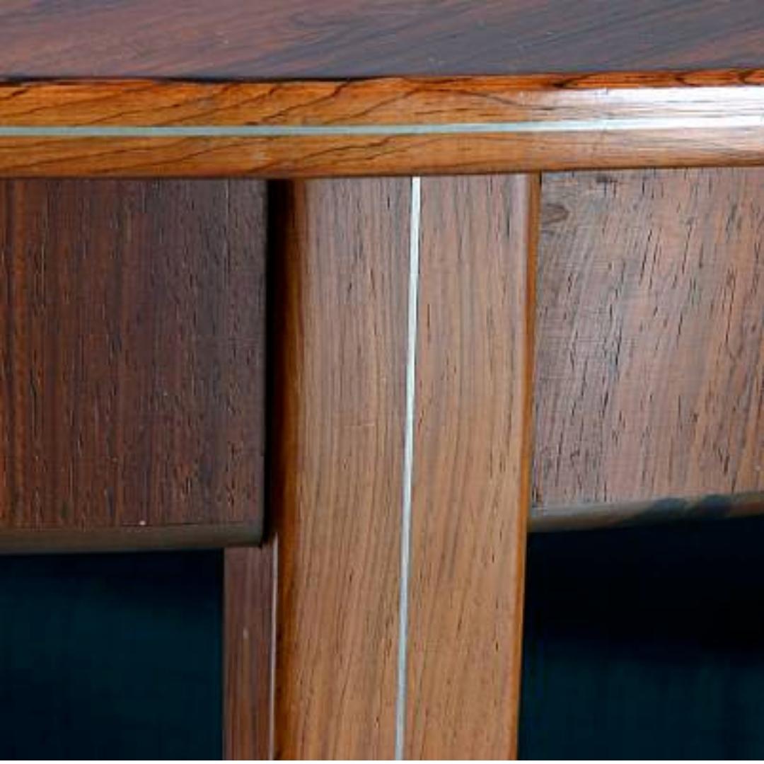 1940s Agner Christoffersen Round Dining Table with pewter detailing inside top and legs. Made by cabinetmaker N.C. Christoffersen, Copenhagen. H. 72 Diameter 125cm extends to 325cm with 4 leaves of 50cm each. The ext mason leaves are not rosewood