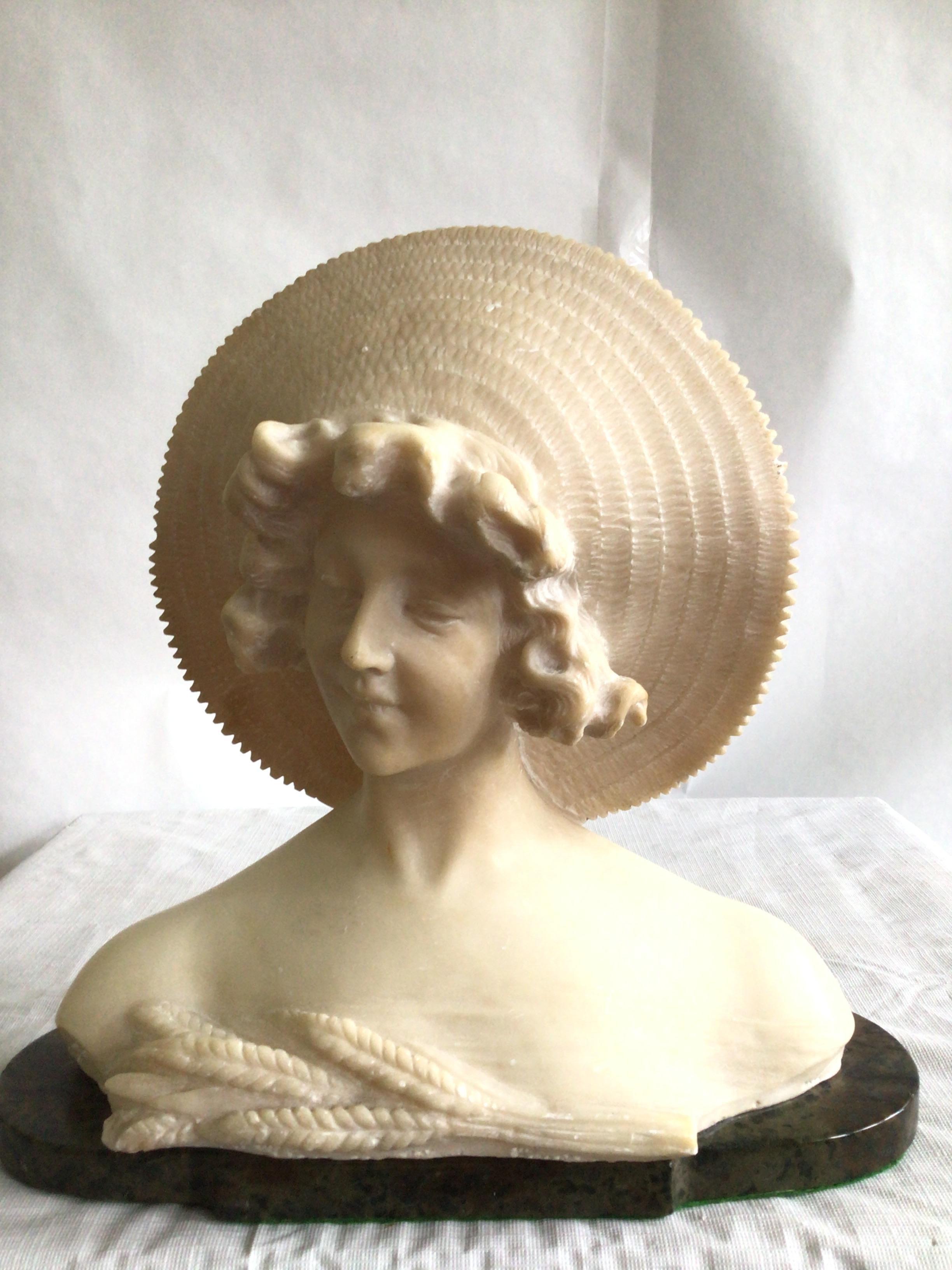 1940s Art Nouveau Style Bust Of A Young Woman On A Marble Base
The sheaf of wheat represents fertility
No signature found
Small knick on the top of hat (as shown)