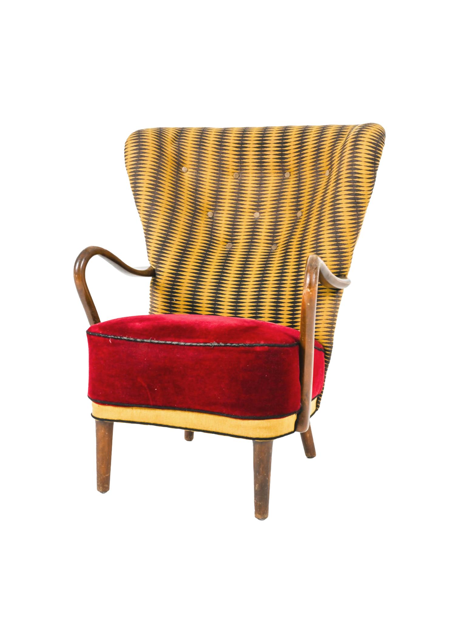 Designed in the 1940s by Alfred Christensen for Slagelse Mobelvaerk, this beautifully constructed Danish Modern armchair consists of a beech frame and a bold mix of upholstery. The fabric work is a later addition. 

This armchair is listed as