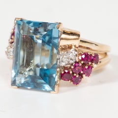 1940s American 8 Carat Acquamarine and 14k Gold Ring with Rubies and Diamonds