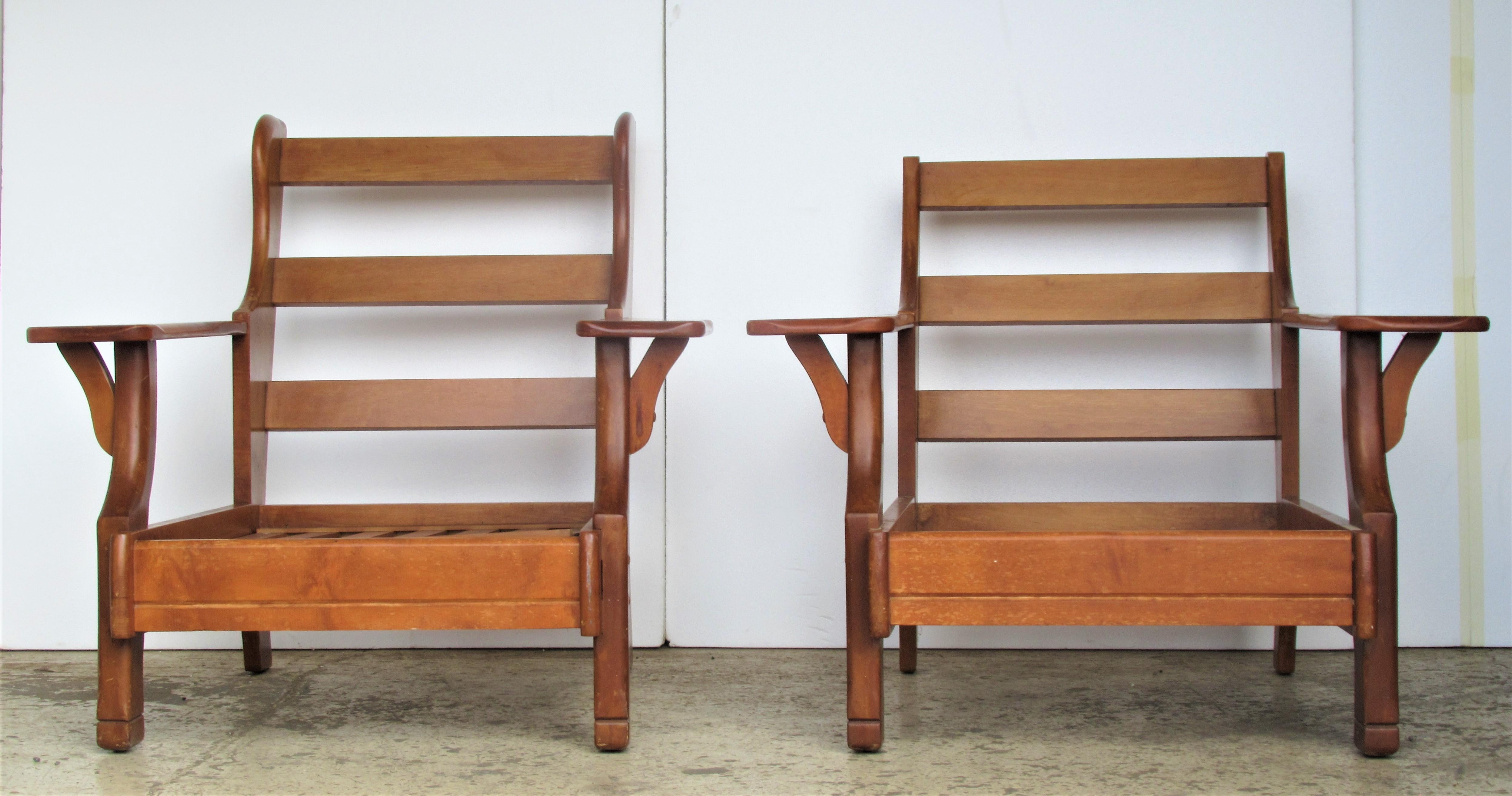 Large-scale rustic wide paddle arm maple lounge chairs attributed to Cushman Furniture of Vermont. When originally manufactured they were sold as a true set with one chair having more of a wing design at upper back sides ( showing both chairs in