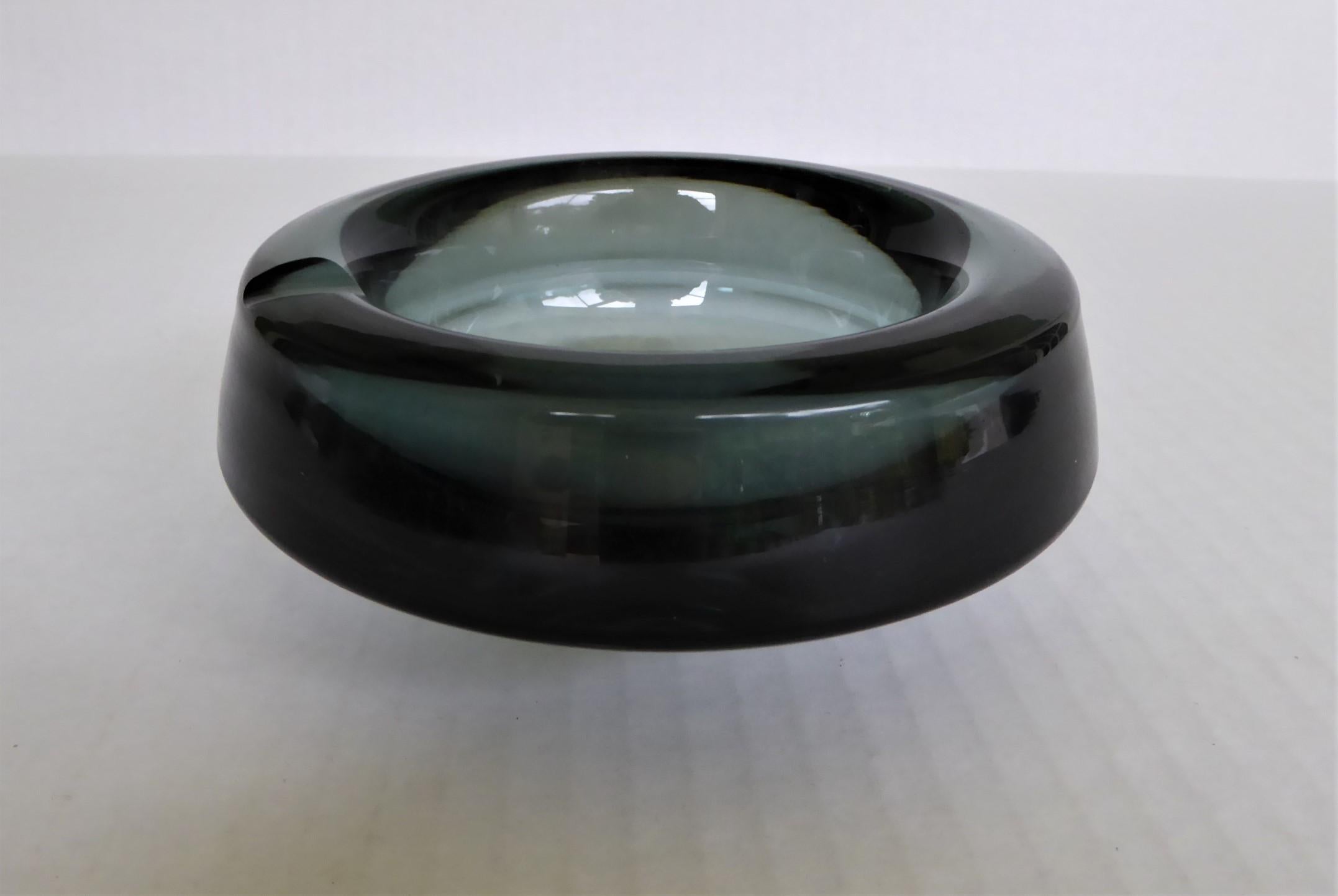 Andries Dirk Copier designed, a signed thick Glass Vessel, Bowl or Ashtray from the 1940s. A 1930s design, Model 2095 and often referred to as the Flying Saucer design. This work is included in the collection of MoMA 1946.
N.V. Koninklijke
