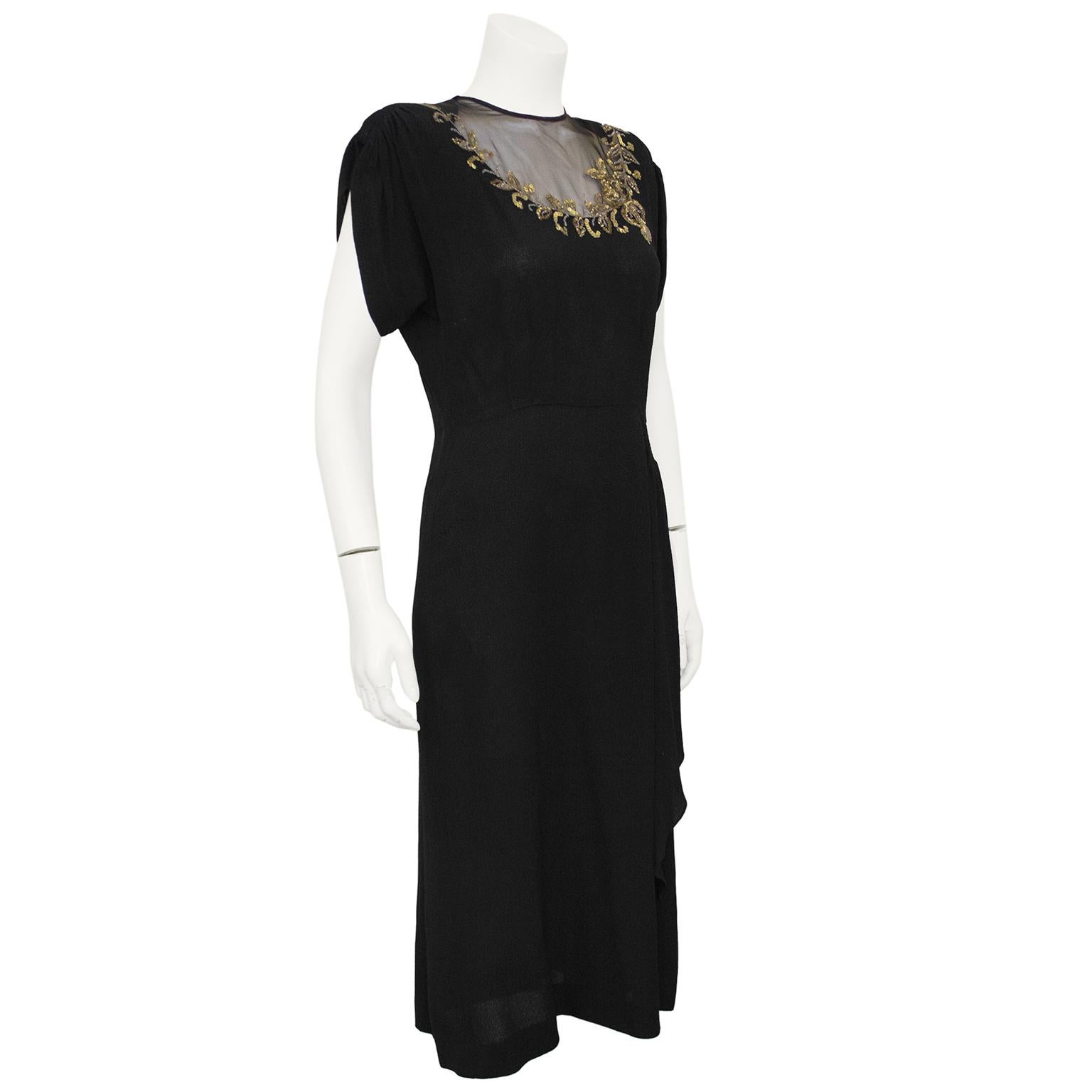 Beautiful 1940s black crepe dress with gold sequin applique. Shoulder pads help hold the shape of the top gathered sleeve and a hip drape detail adds dimension to the silhouette along with vertical darts at the waist. The beautifully constructed