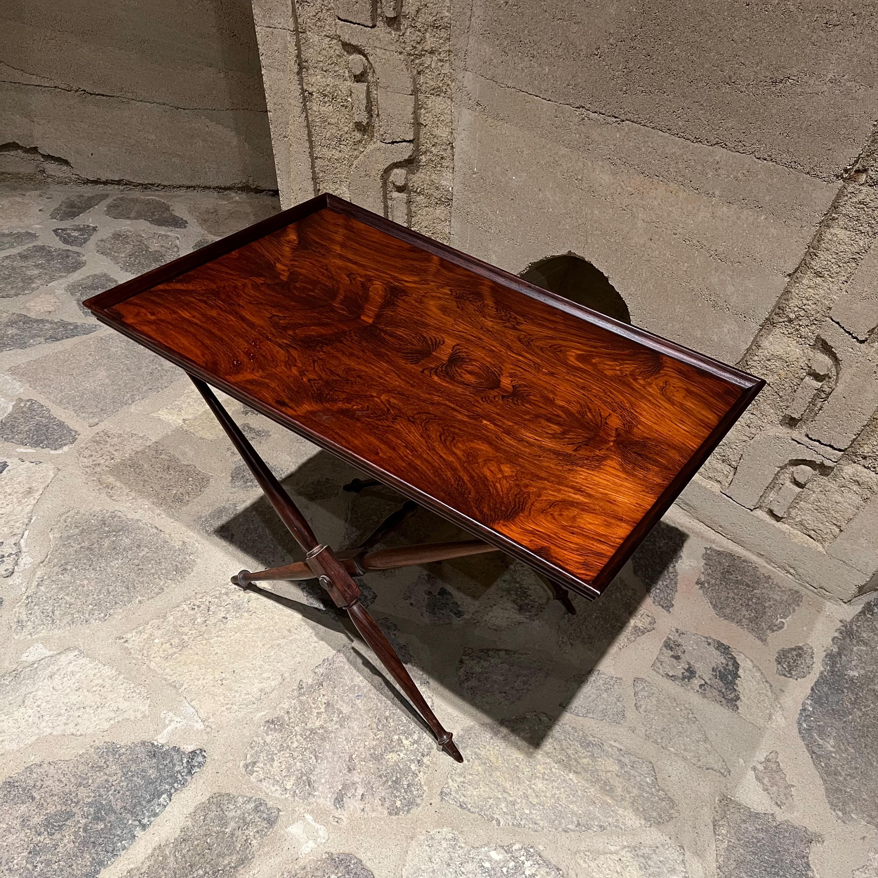 Folding table.
Stylish Art Deco Egyptian folding table in rosewood 1940s. 
In the style of Mogens Lassen for A J Iversen
USA no label is present. 
Folded 28.25 tall x 18 wide x 3 deep, assembled 19.25 tall x 28.25 wide x 18.
Original preowned