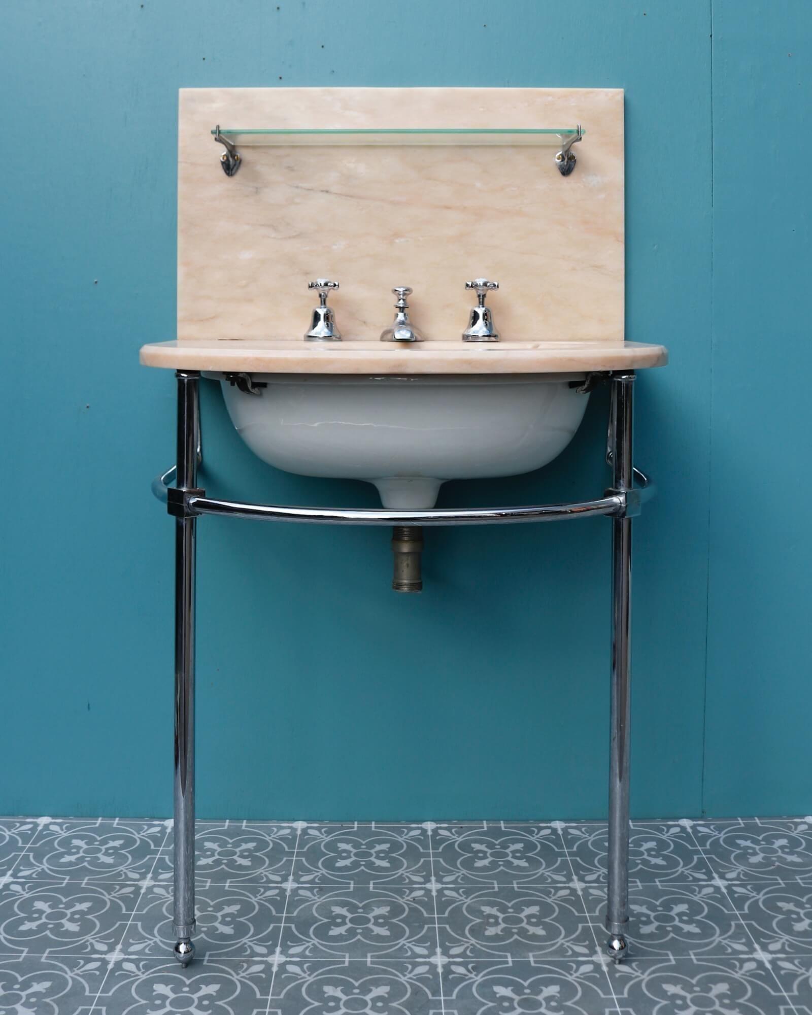 An English Art Deco style marble washstand with chromed fittings by John Bolding & Sons dating from the 1940s. Reclaimed from a property in Haywards Heath UK, this smart antique bathroom basin is a stunning washstand for a luxurious midcentury style