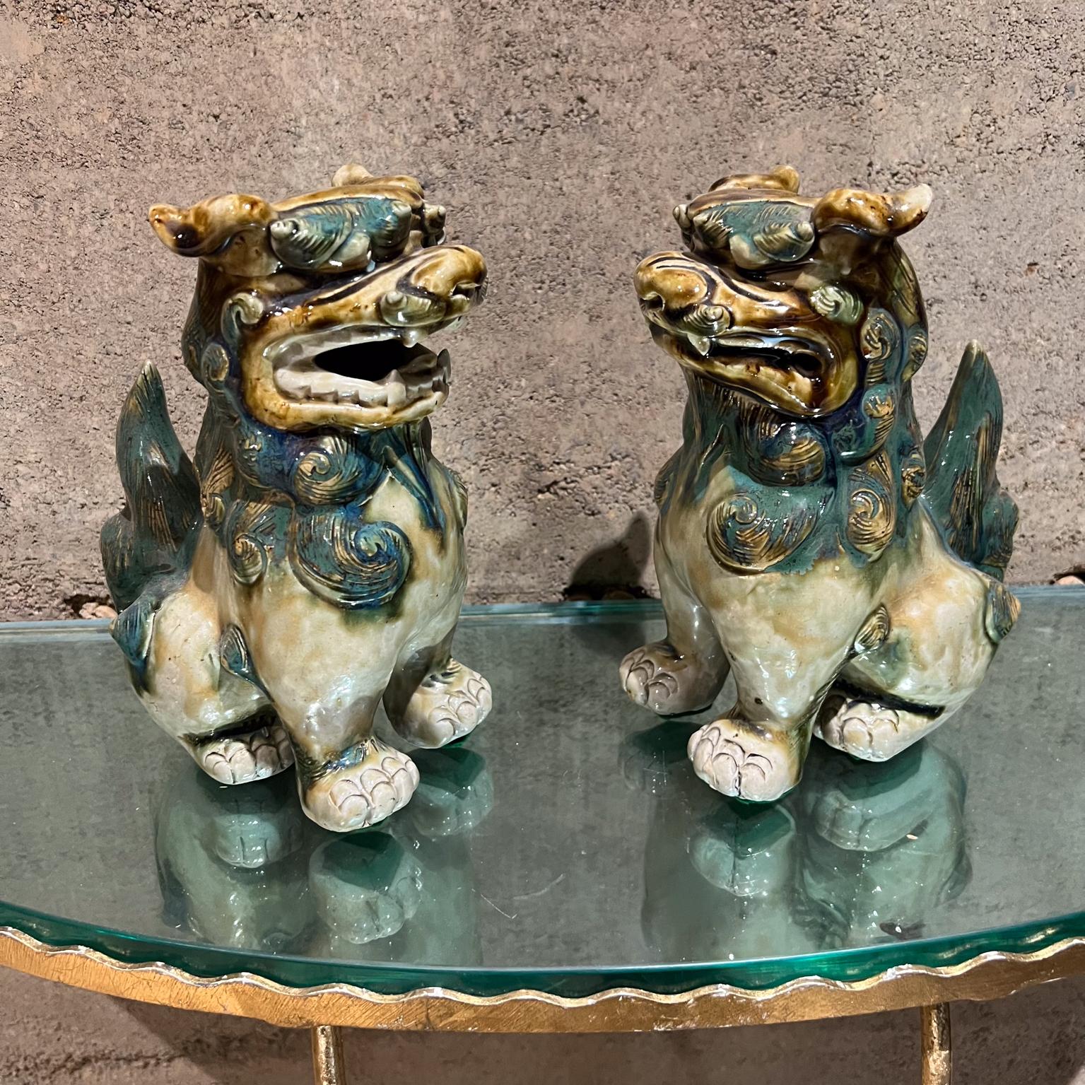 Pair of Antique Chinese Figurines Foo Dog Sculpture
Green Glaze Ceramic
8 tall x 3.75 w x 6.5 d
Preowned original vintage condition.
Refer to images please.