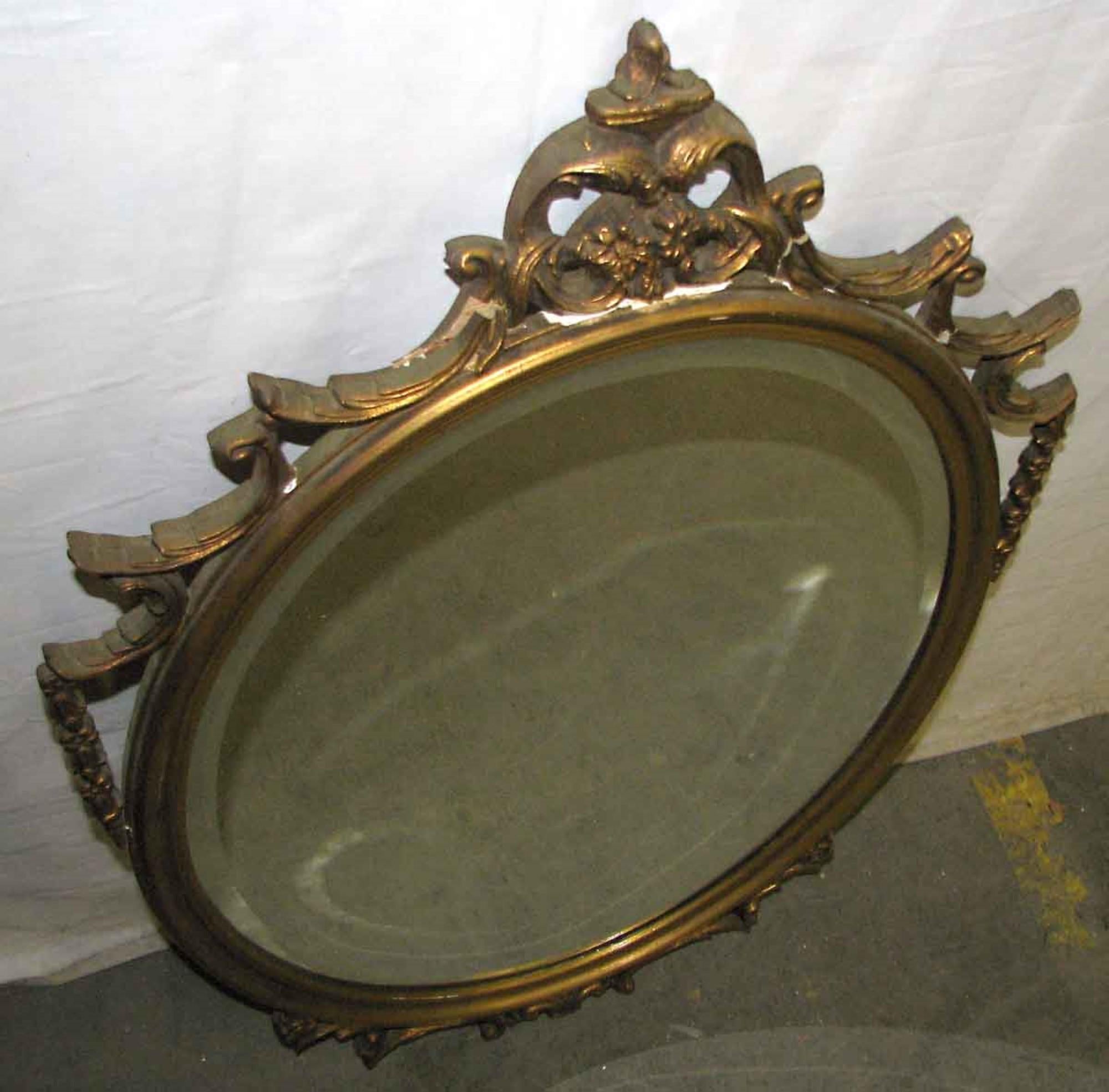 1940s Antique Hand Carved Wood Frame with Oval Beveled Mirror Done in Gold Gilt 1