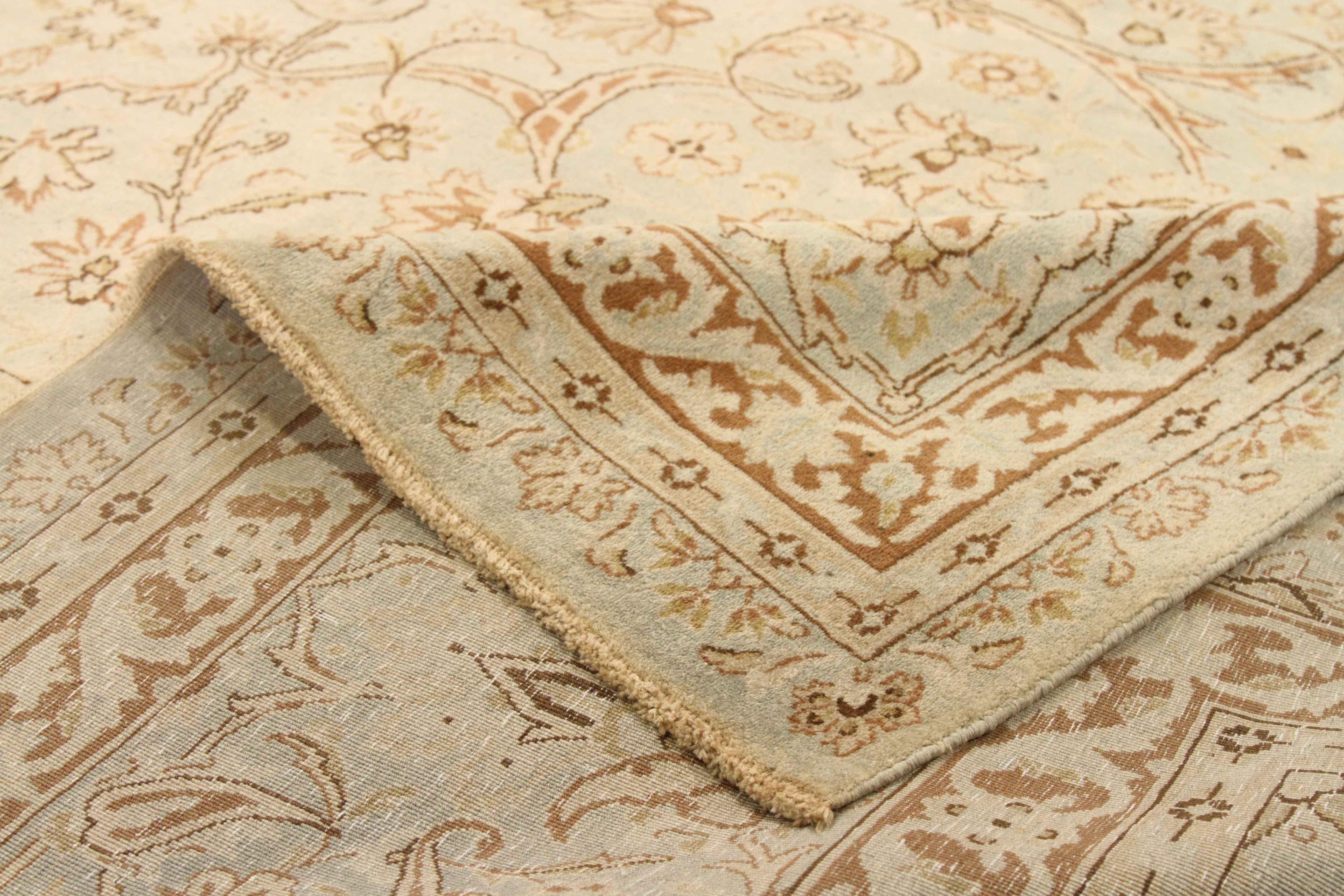 Antique Persian rug made in the 1940s. It’s handmade from fine, exquisite wool and colored with rich organic vegetable dyes. It features a field with abundant flowers and nature-inspired elements. There are also two borders around it with tribal