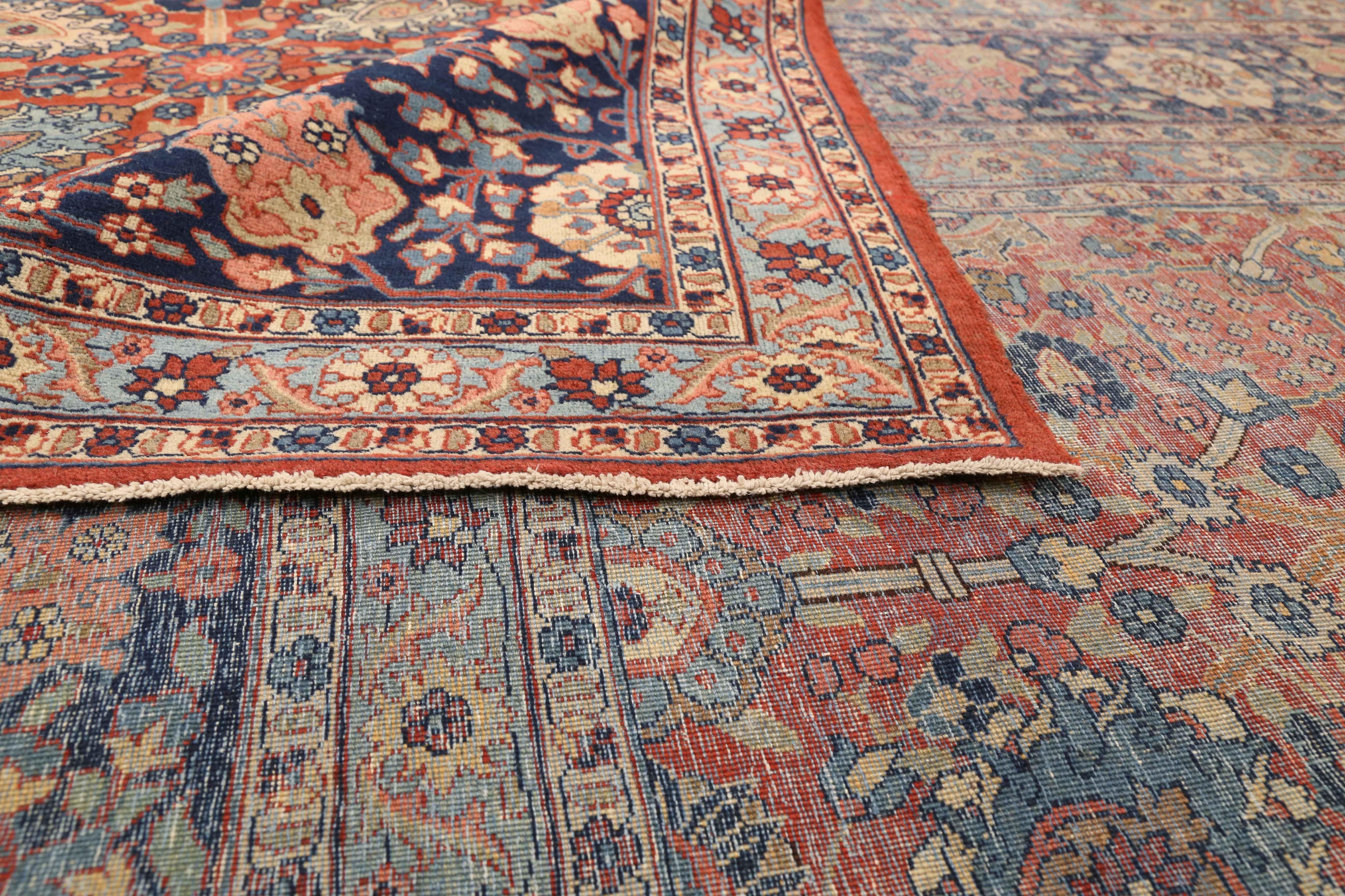 Antique Persian rug handmade in the 1940s. Weavers used fine and exquisite wool colored with rich all-organic vegetable dyes. It shows a traditional style rooted in the Classic designs of world-famous Safavid carpets that were created infamous rug