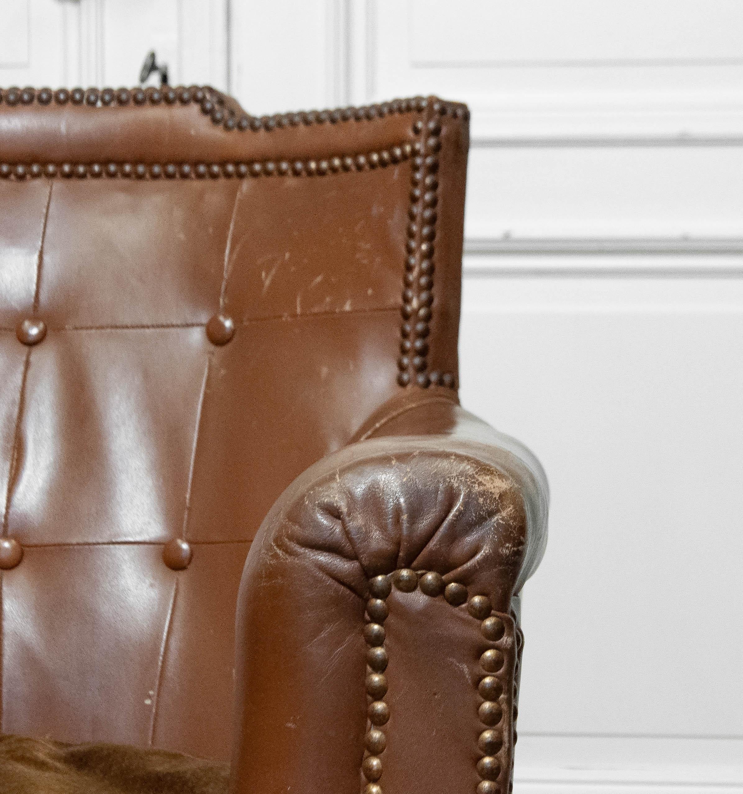 Otto Schulz for Boet, Gothenburg, Sweden, 1940s. Elegant armchair in original brown leather with a tufted back and decorative nailhead trim. Features the original brown velvet cushion, intact internal springs, and webbing—all in very good condition.