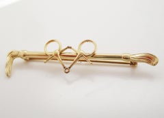 1940s Art Deco 14 Karat Yellow Gold Snaffle Bit Bar Stock Crop Pin