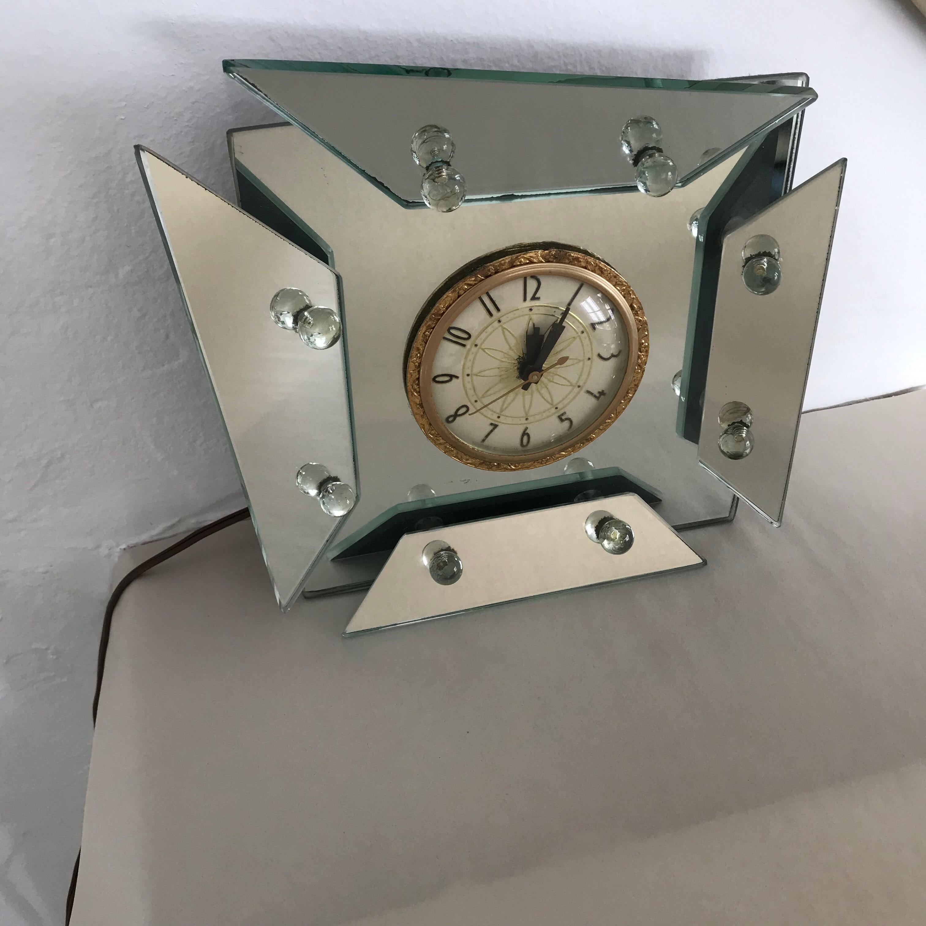 Art Deco asymmetrical faceted silver mirrored mantel or table clock by Clock Movement by Lanshire.