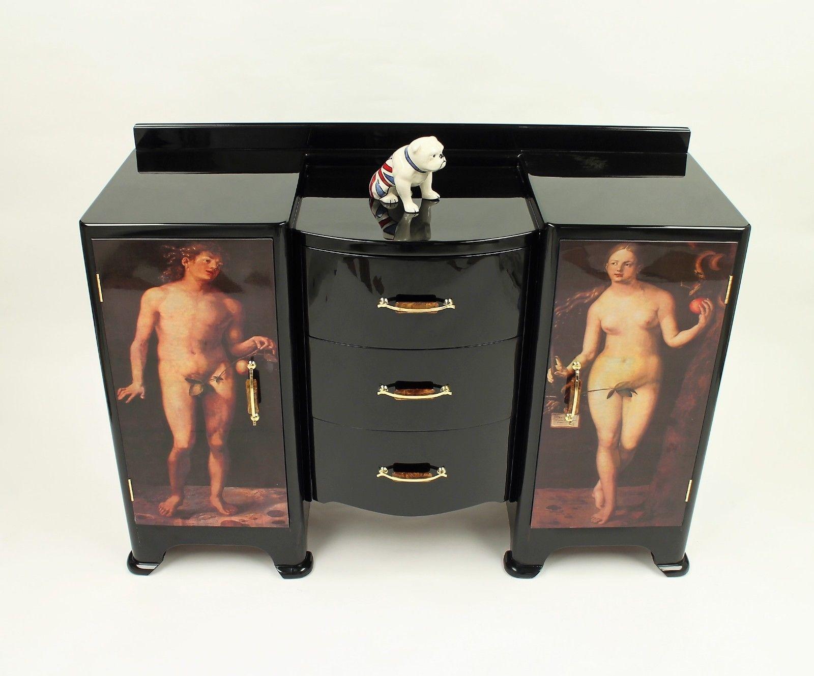 We have here is a 1940s sideboard/credenza of quality
Consisting of two cupboards each with a shelf and a draw, with a central three draws,
A one of a kind piece, this would enhance any stylish room.
Adam & Eve artwork is applied and then sealed