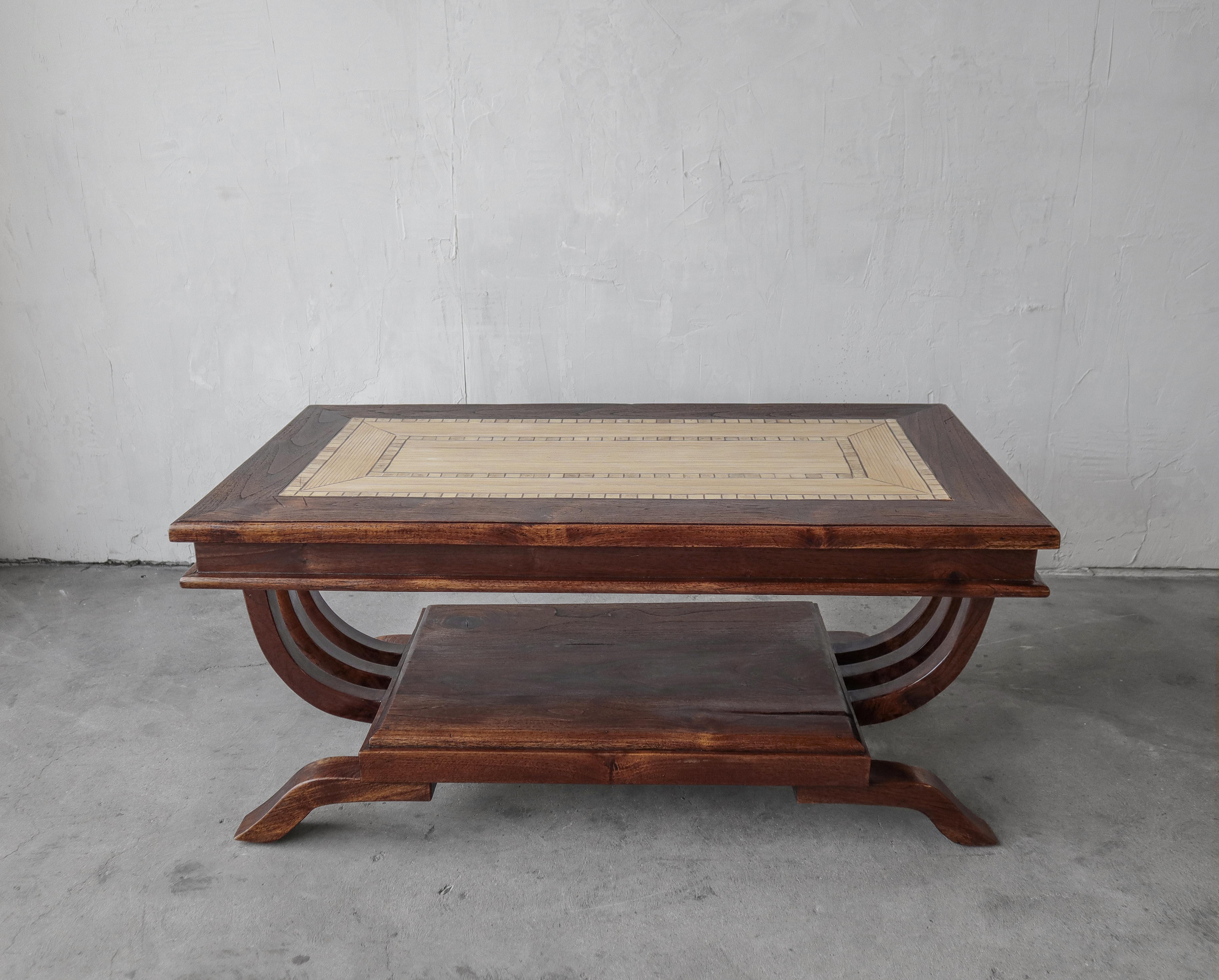 Beautiful, all original Art Deco coffee table. Table is solid walnut with a gorgeous bamboo inlay with a triple u-shape stretcher base.

Table is left as found, it is structurally sound with great age appropriate wear and patina. There are minimal