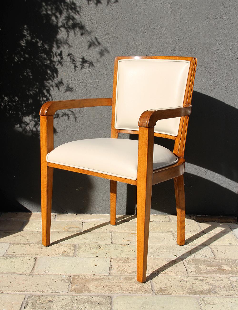 One beautiful 1940s era Art Deco desk chair from French Governmental Institute.

This beechwood Art Deco chair has been beautifully refinished with a natural satin varnish and wax and reupholstered with a natural cream off-white leather. The