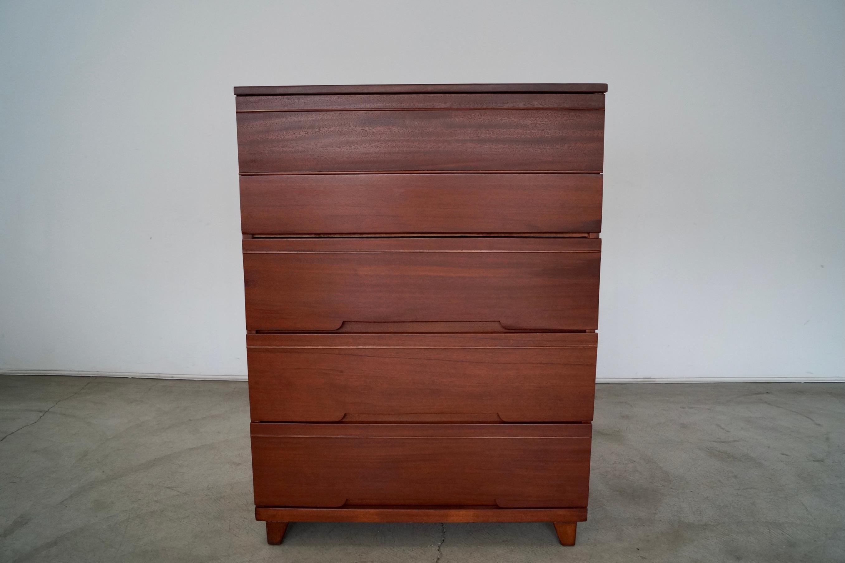 Vintage Mid-century Modern dresser for sale. From the late 1940’s, and made of mahogany. It was previously professionally refinished in walnut, and is a solid well made piece with vintage construction. All drawers are dovetailed on both ends. It has