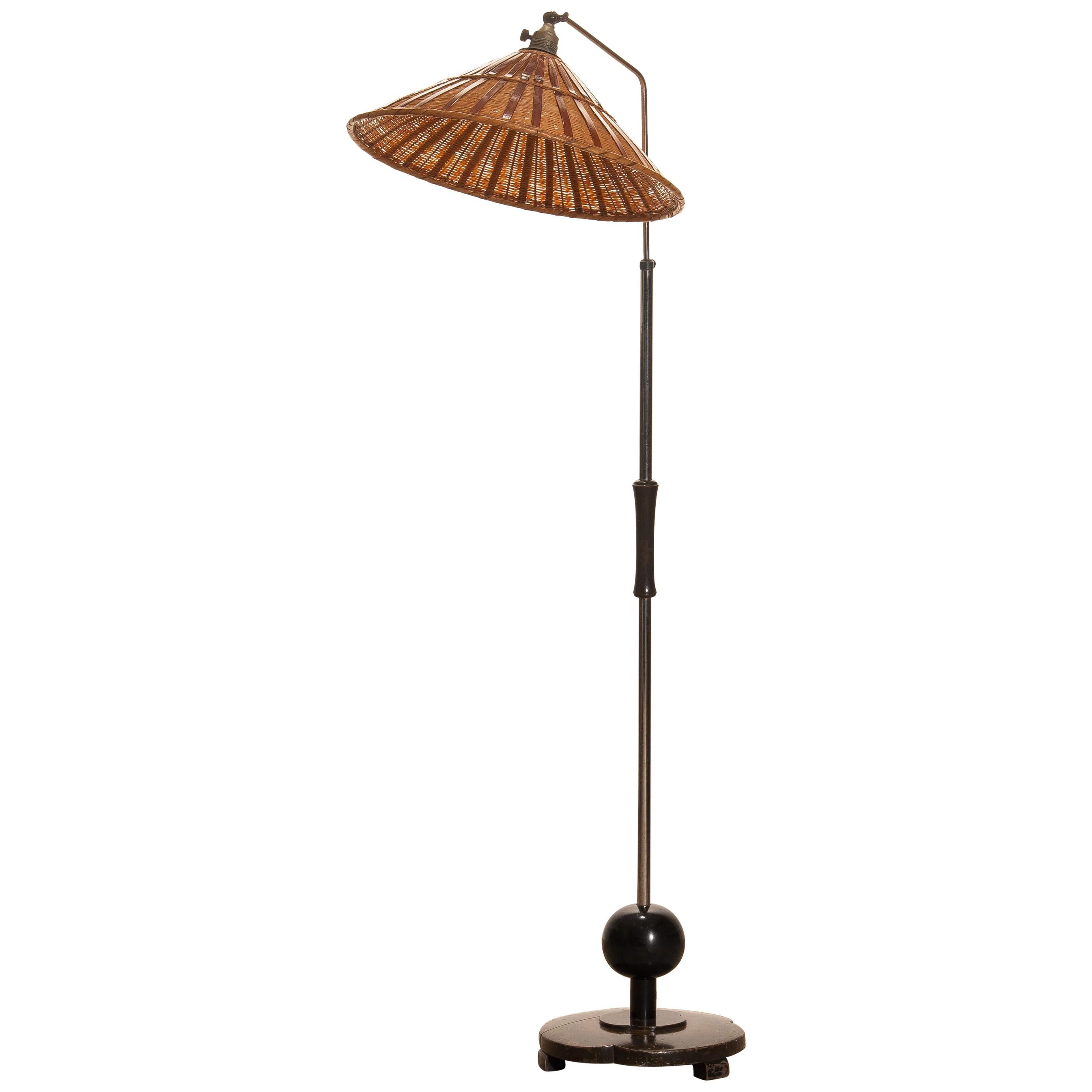 Limited edition: Numbered 12 out of 85,
1940s. This extremely beautiful and complete original, Italian, Art Deco or Jugendstil floor lamp with burl wood floor stand and handle is in perfect condition. The original handmade, wicker shade is also in