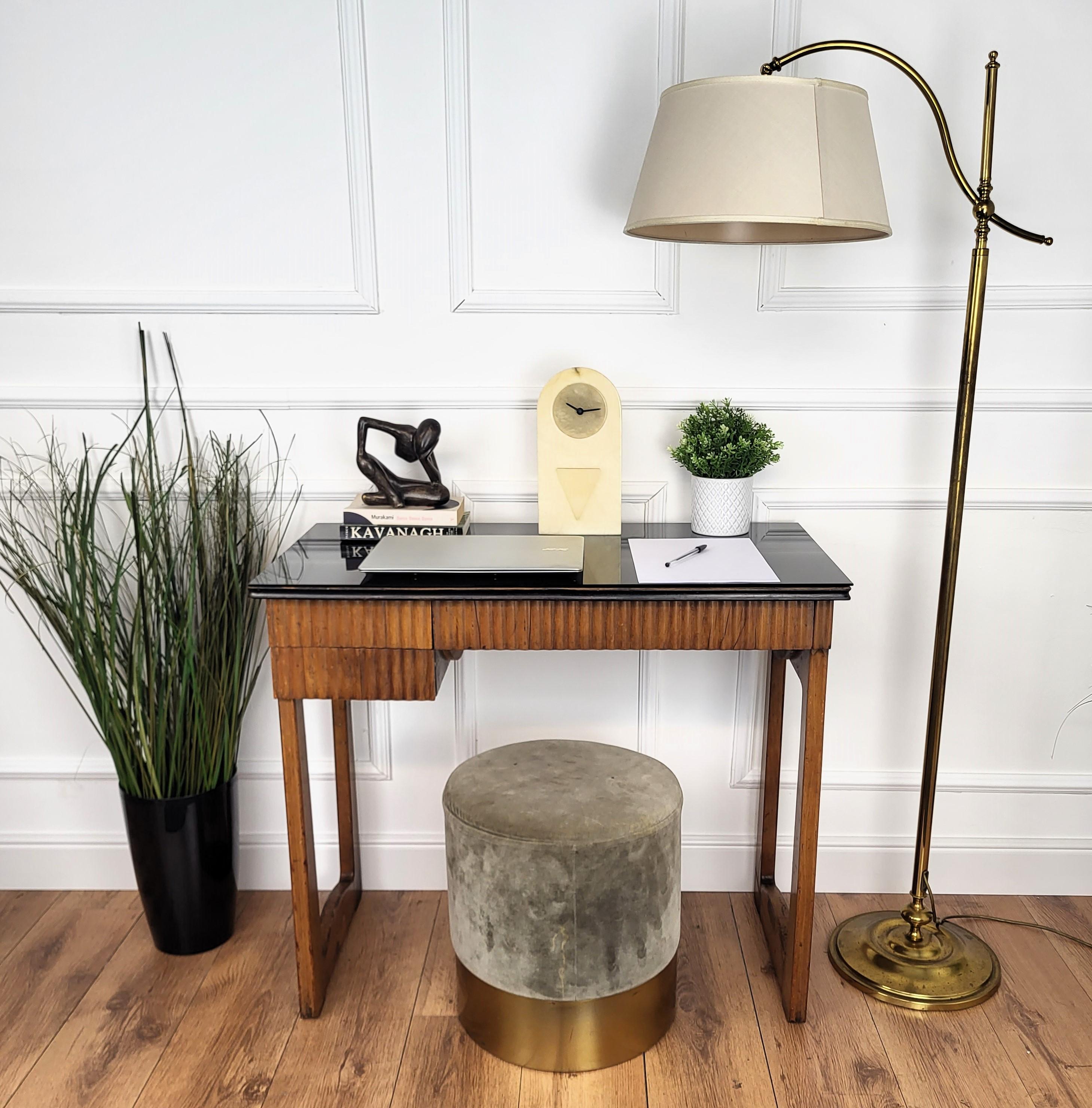 Very elegant Italian Art Deco Mid-Century Modern desk writing table, with beautiful front carved slats and side drawer, completed with its elegant black glass top. This table used to be a knitting machine and has been refitted as a desk console. The