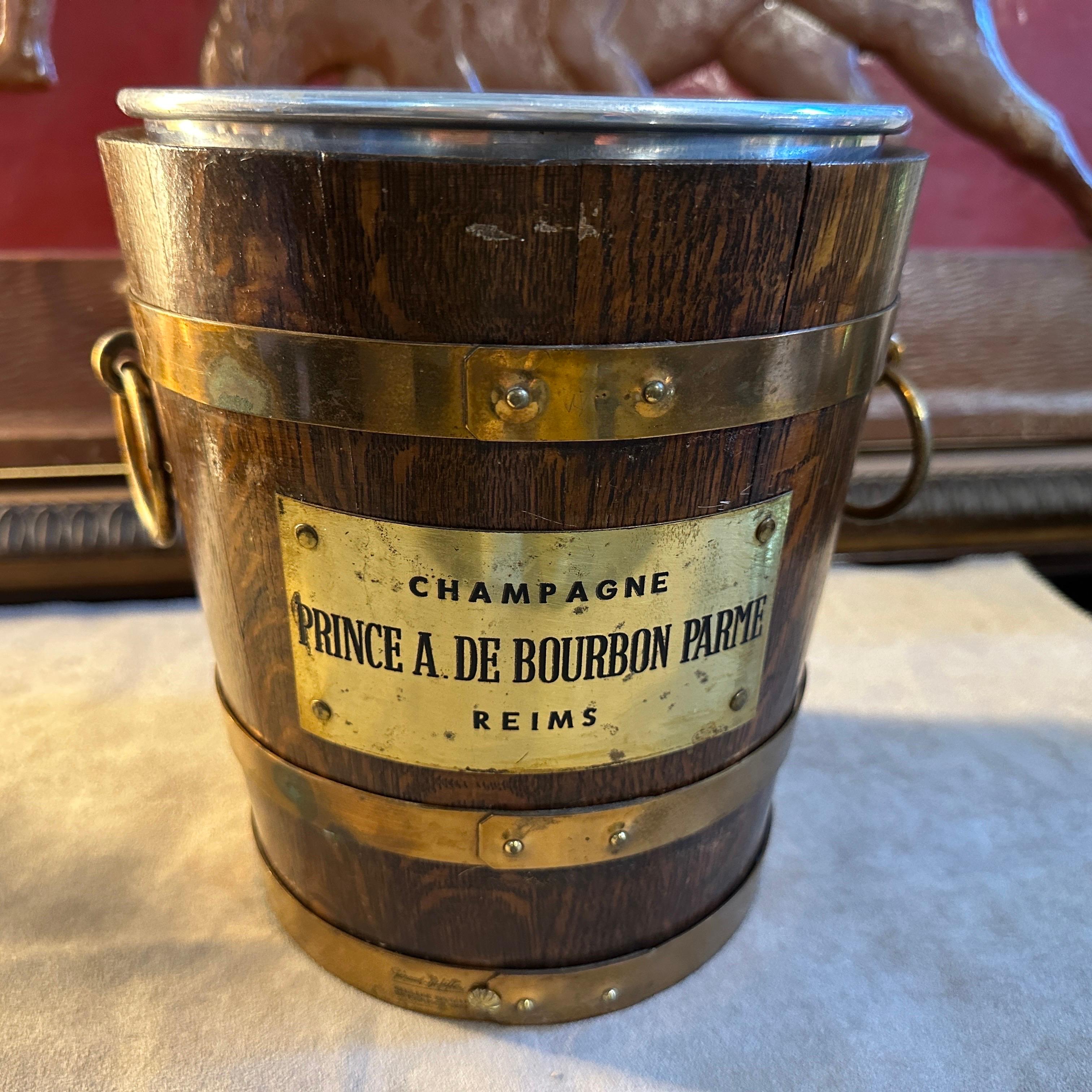 An amazing oak and brass wine cooler hand-crafted in France by Geraud Lafitte for Abel Le Pitre in the Forties, it's in original condition with normal signs of use and age, marked on a side Geraud Lafitte 