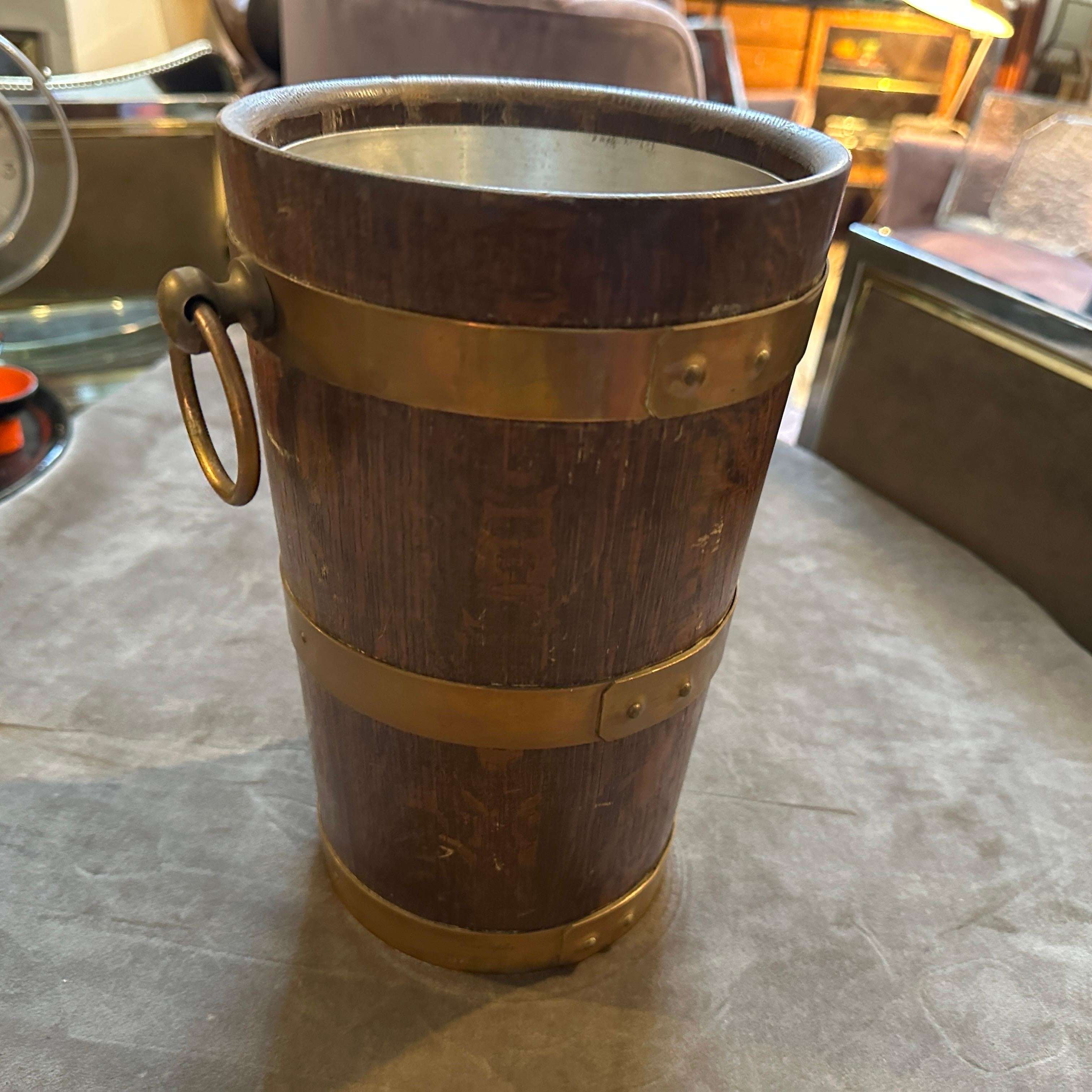An amazing oak and copper wine cooler designed and hand-crafted in France by Geraud Lafitte in the Forties, it's in original condition with normal signs of use and age, marked on a side Geraud Lafitte 