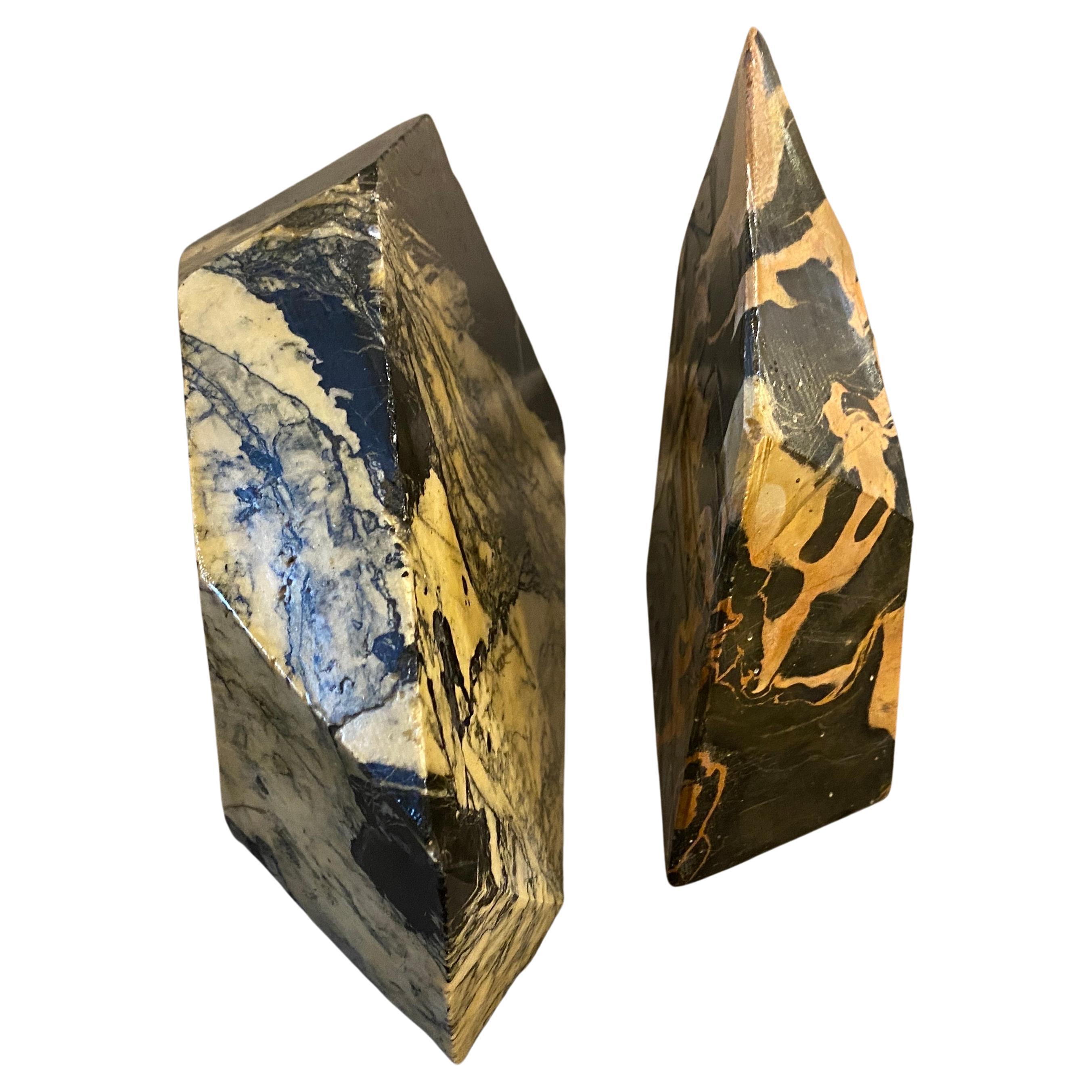 A pair of asymmetrical marble bookends manufactured in Italy in the Forties. The Portoro marble, or Portovenere marble, is a fine variety of Italian marble from the suggestive Gulf of Poets, in the Ligurian province of La Spezia, and is one of the