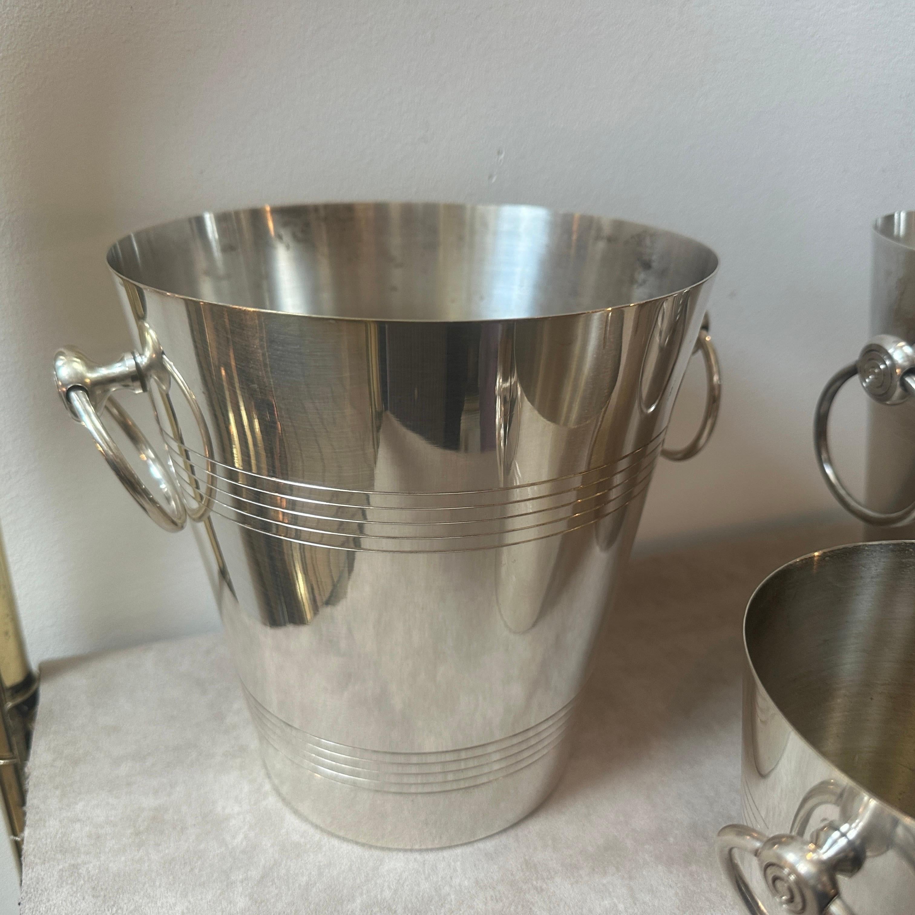 A set of two wine coolers and one ice bucket designed and manufactured in France by Gelb, the three pieces are in very good conditions with small signs of use and age. Height of the ice bucket is cm 13,5. The 1940s art deco design of the set