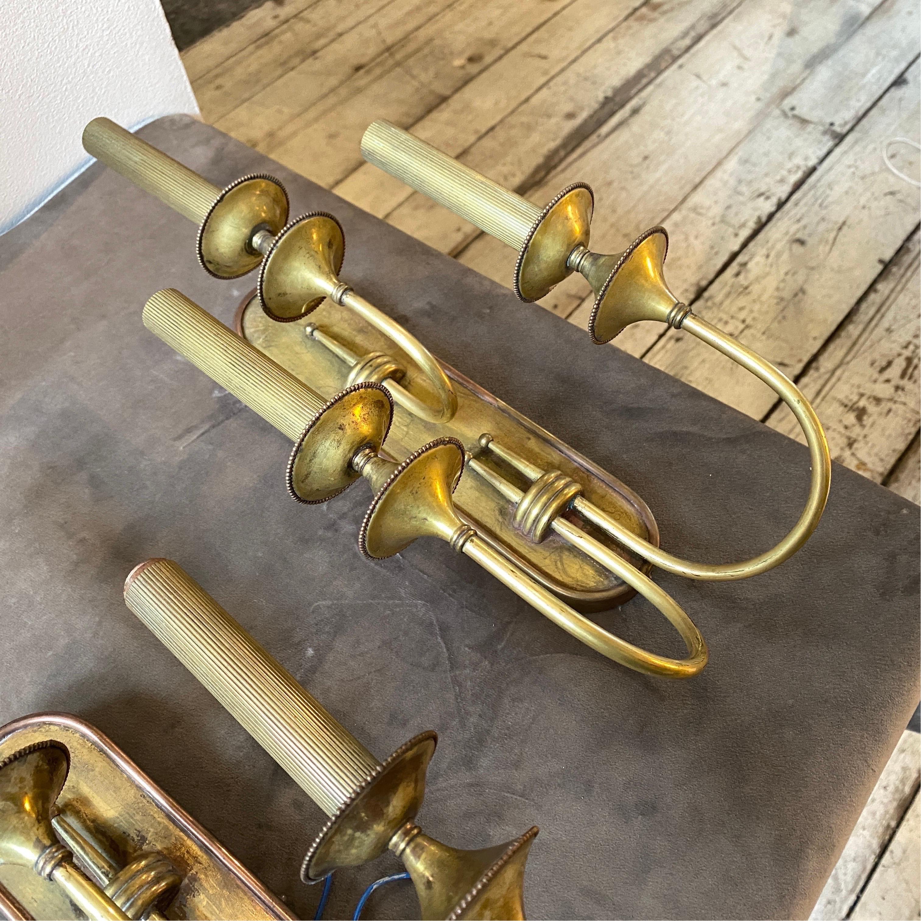 Set of two brass wall sconces made in Italy in the Forties, solid brass it's in original patina. They work both 110-240 volts and need three regular e 14 bulbs.