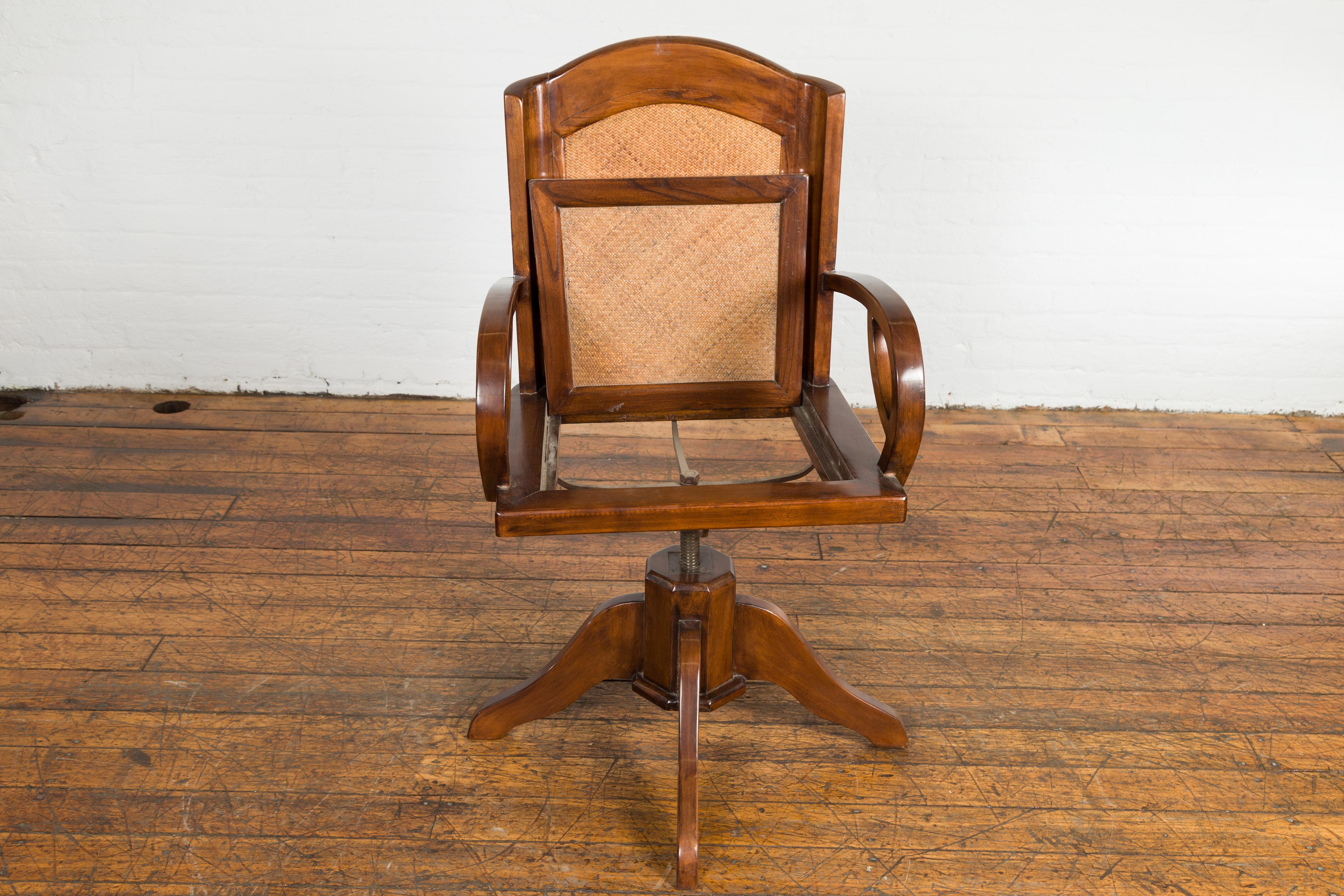 Indonesian 1940s Art Deco Style Swivel Desk Chair with Woven Rattan and Loop Arms For Sale