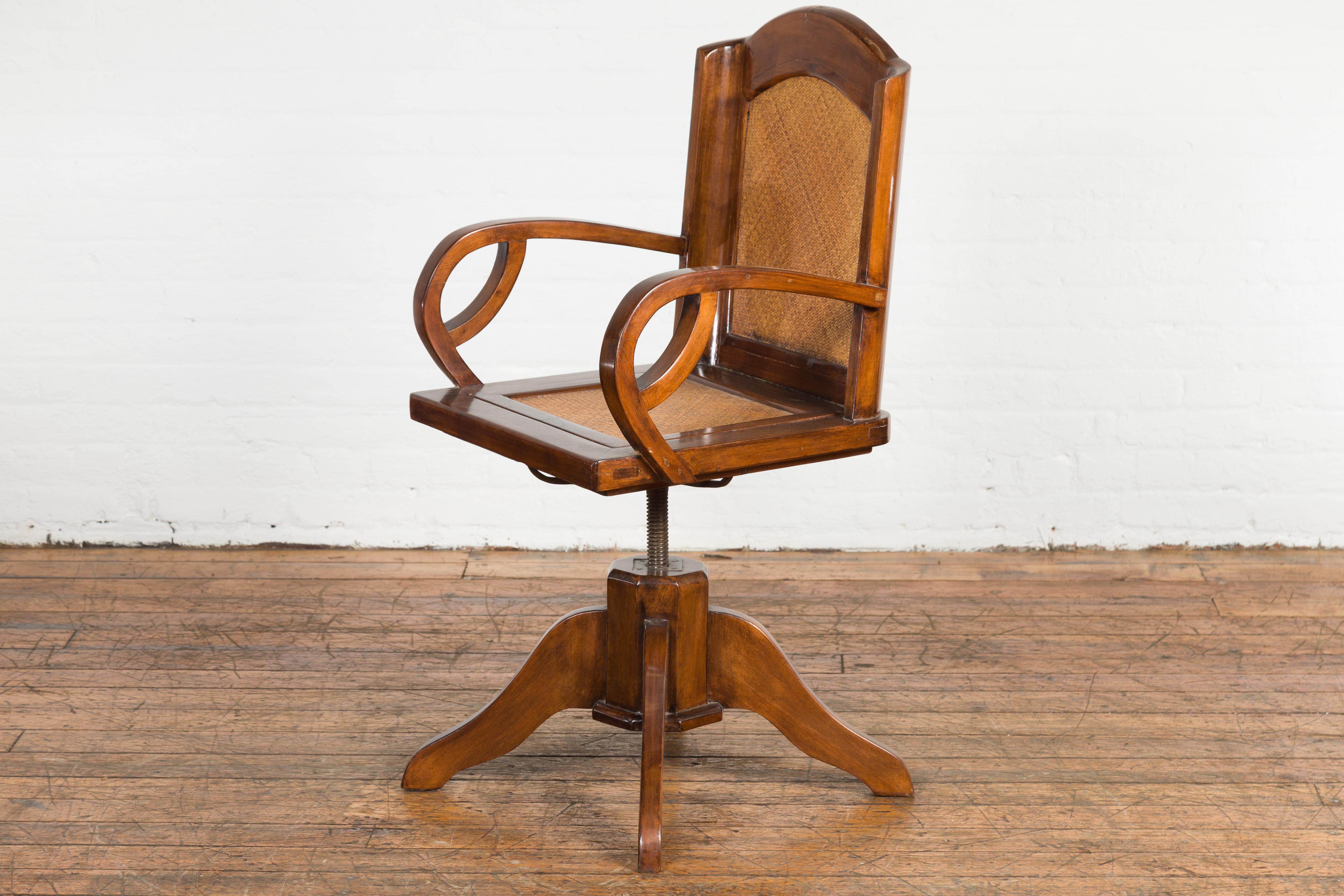 20th Century 1940s Art Deco Style Swivel Desk Chair with Woven Rattan and Loop Arms For Sale