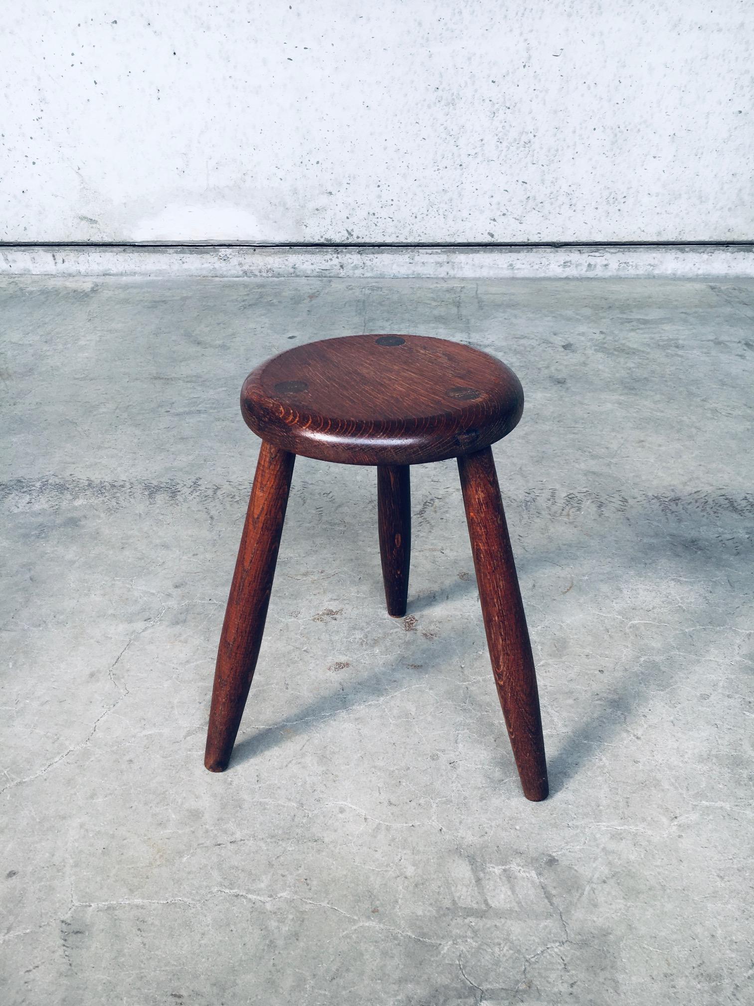Vintage Artisan Hand Made Turned Oak Tripod Stool. Made in Belgium, 1940's period. Solid oak wood turned stool on three legs. Very well made with nice proportions. In very good, all original condition. Measures 42,5cm x 38cm x 38cm.