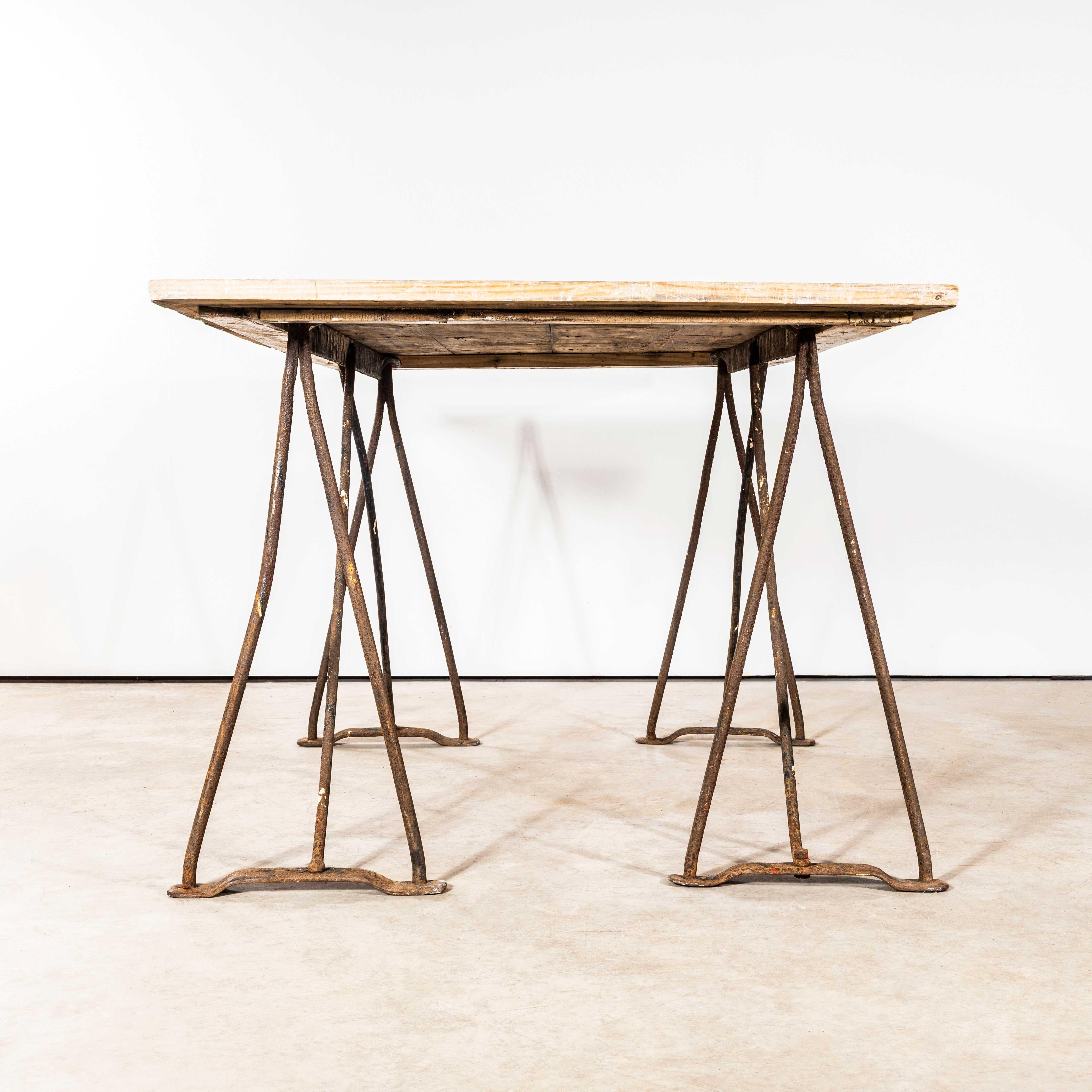 1940’s Artists High Console Table – Forged Iron Trestle Bases. 
Sourced in Cornwall the table is a crudely made artists high table. The top sits snugly but loose on the two forged metal trestles, the top is crude pine planks with a framed