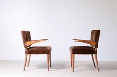 1940's attributed pair of chairs with cantilevered armrests