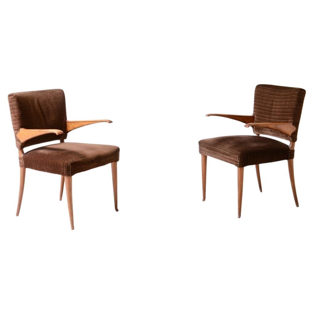 1940's attributed pair of chairs with cantilevered armrests