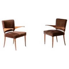 1940's attributed pair of chairs with cantilevered armrests