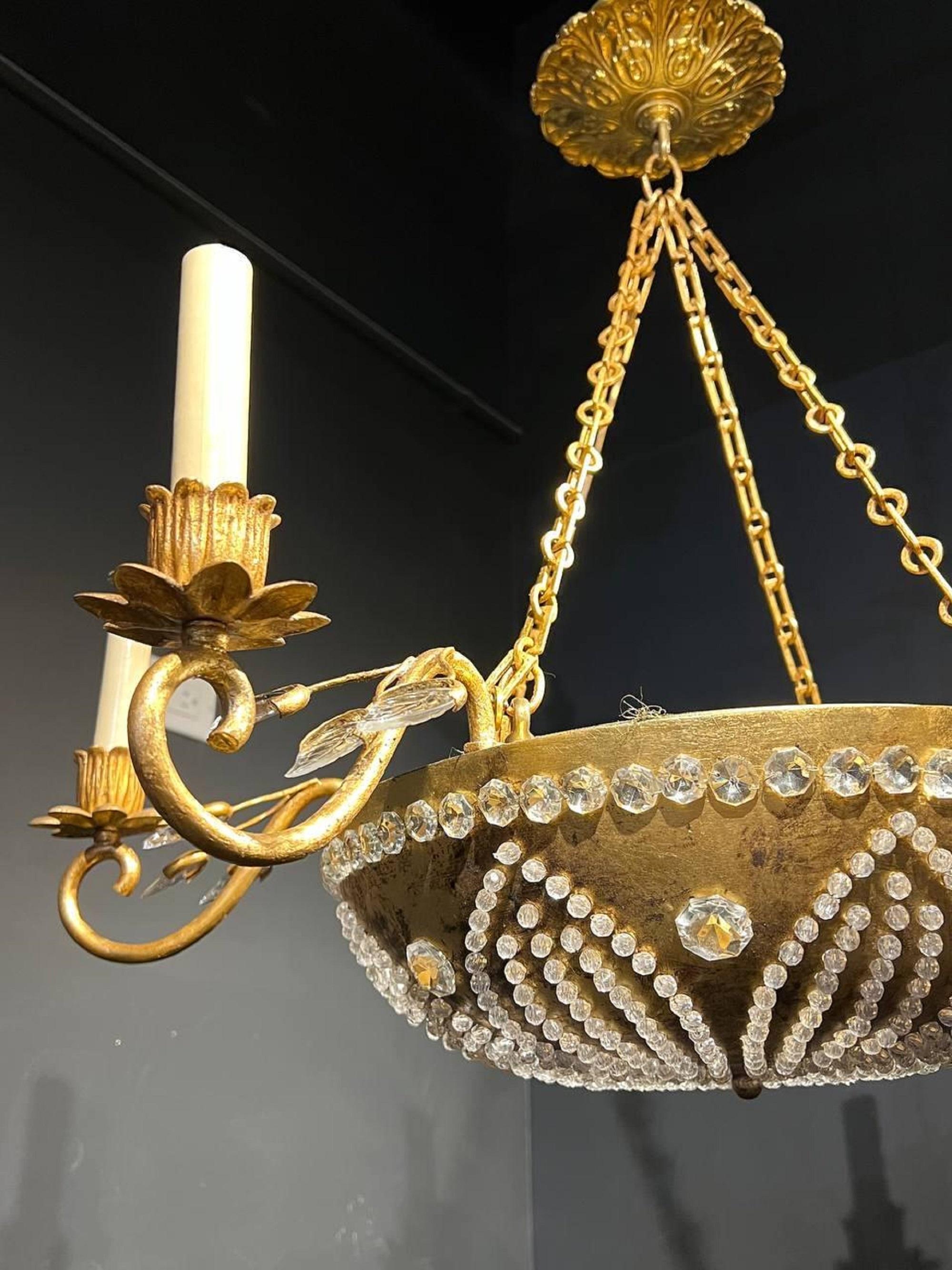 A circa 1940’s French Bagues light fixture with beaded crystals and interior light.

Dealer: G302YP
