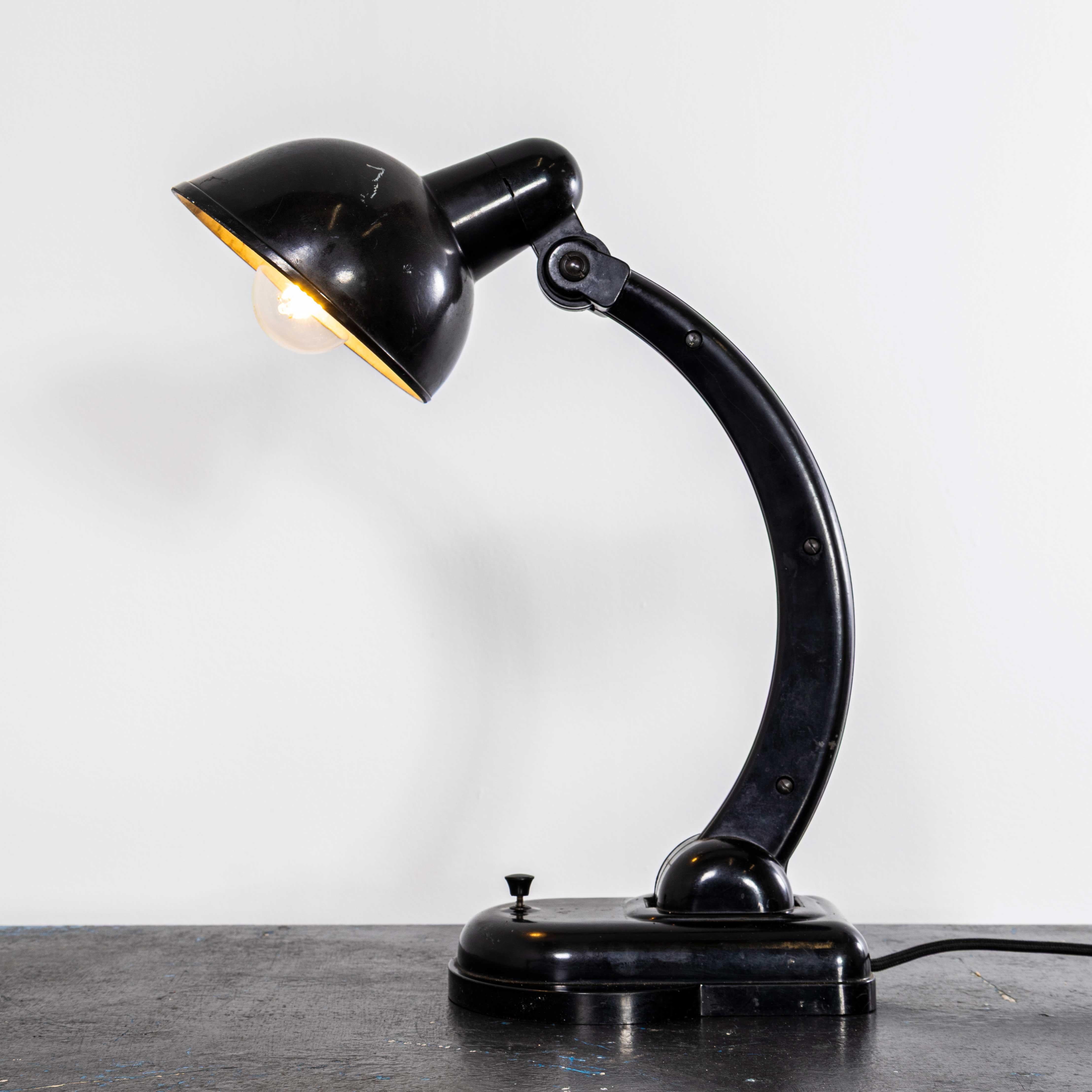 1940’s Bakelite Early Adjustable Desk Lamp. 
The lamp was produced in Eastern Europe in the forties, made almost totally in Bakelite. The lamp has been cleaned and restored but we have left the history and character, and where possible all