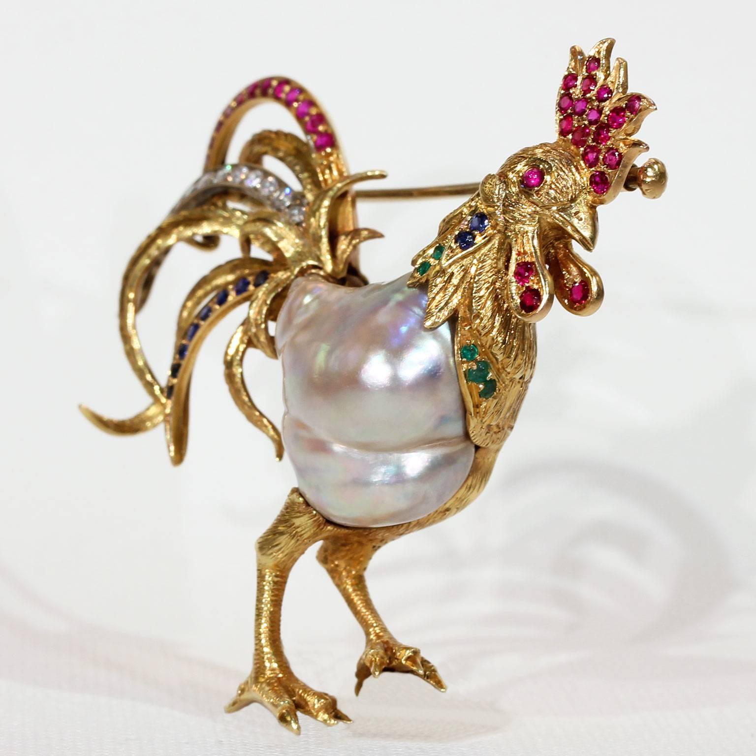 Here is a wonderful and cheeky rooster who is beautifully hand crafted. The body of the bird is created from a large, natural, Baroque Pearl. His tail is set with a spray of rubies, diamonds and sapphires; and his head is further set with rubies,