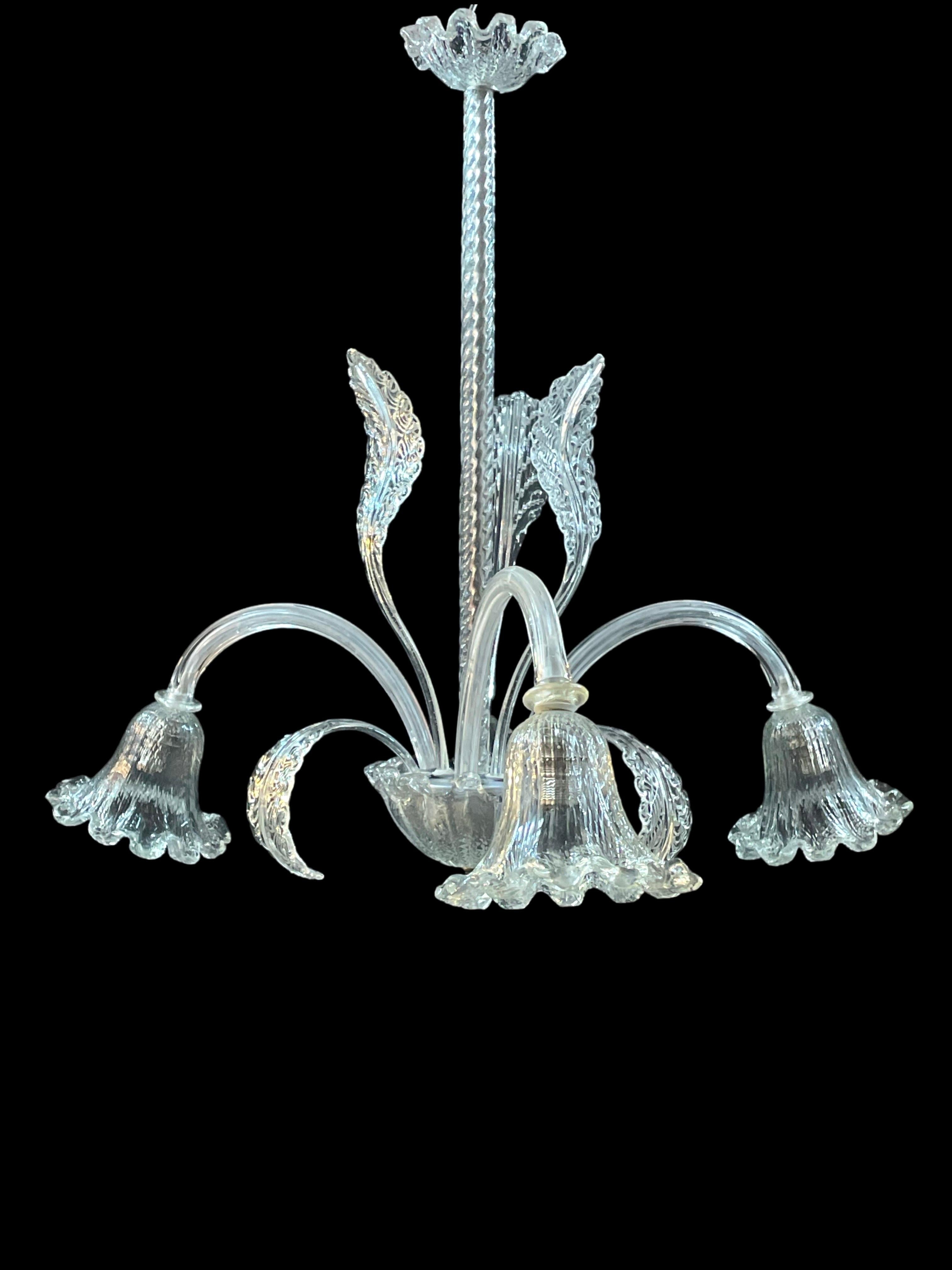 Introducing a stunning piece of vintage lighting from the 1940s – a masterful Murano glass chandelier attributed to the renowned Barovier & Toso.

Crafted from original mouth-blown glass, this exquisite fixture features three elegantly curved arms,