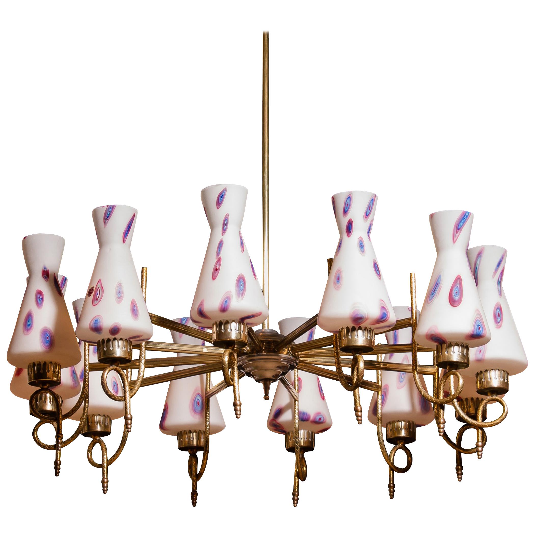 Magnificent large chandelier.
This lamp is made of a beautiful brass with polished aluminium shape with twelve white designed Murano glass shades and made by Stilnovo.
Dimensions: H 90 cm, ø 80 cm.
 Technically 100%