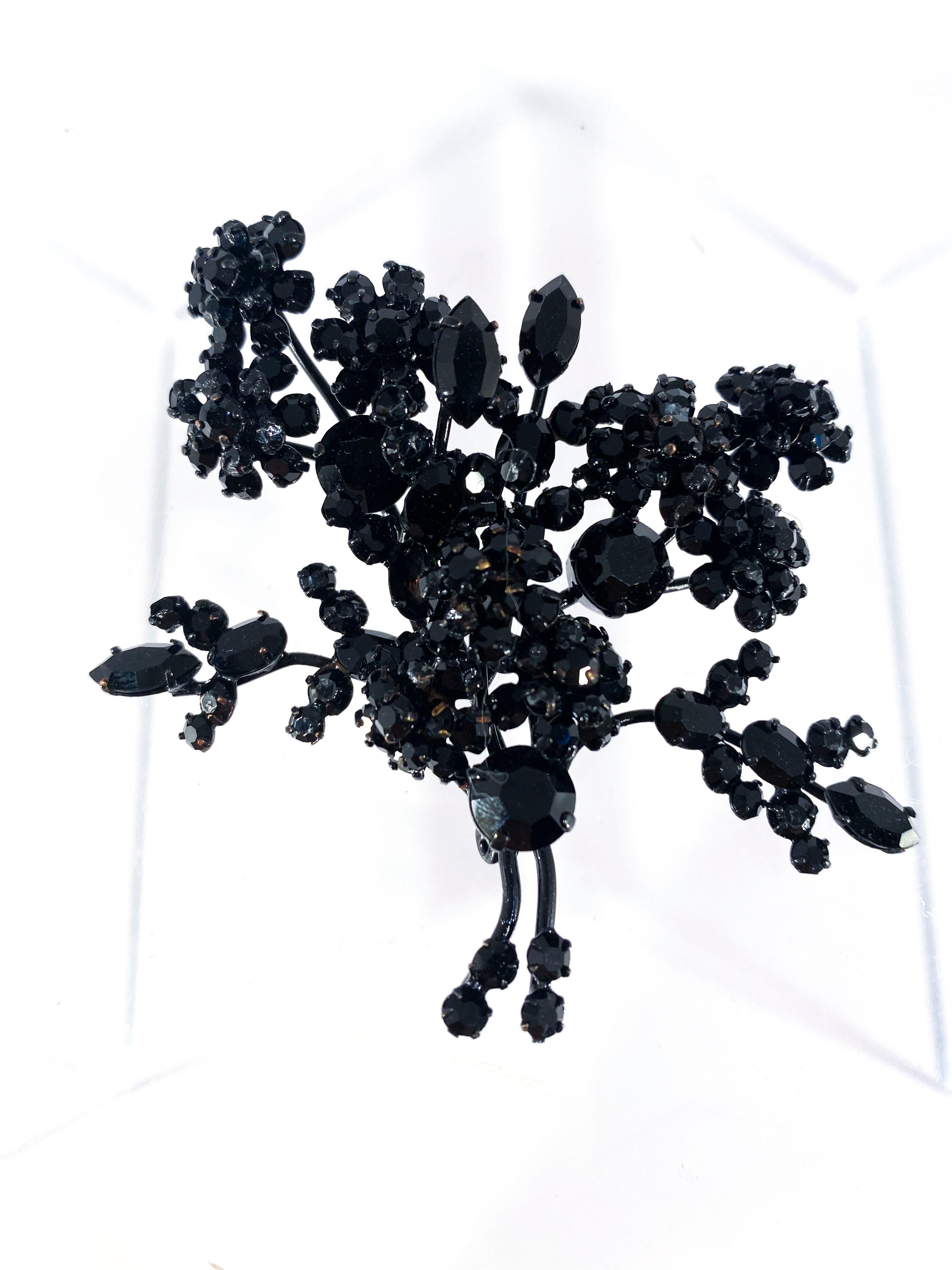 1940s Black Austrian brooch feating black rhinestones that are configured into a floral bouquet design.