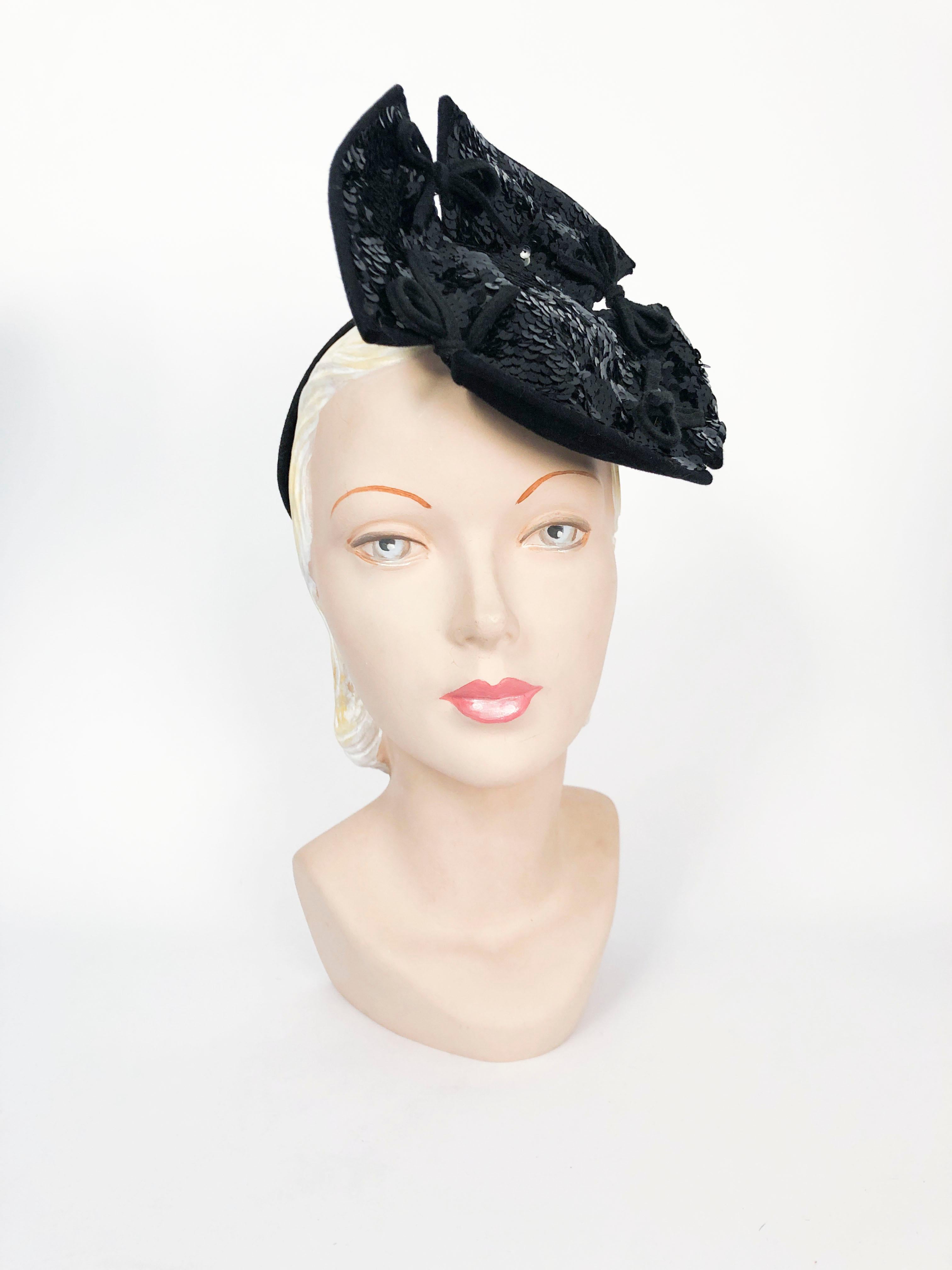 1940s Black Sequin Cocktail Hat made of fur felt in a windmill shape, and decorated with felt bows. Structured hat ring attached to further secure the hat to the head.