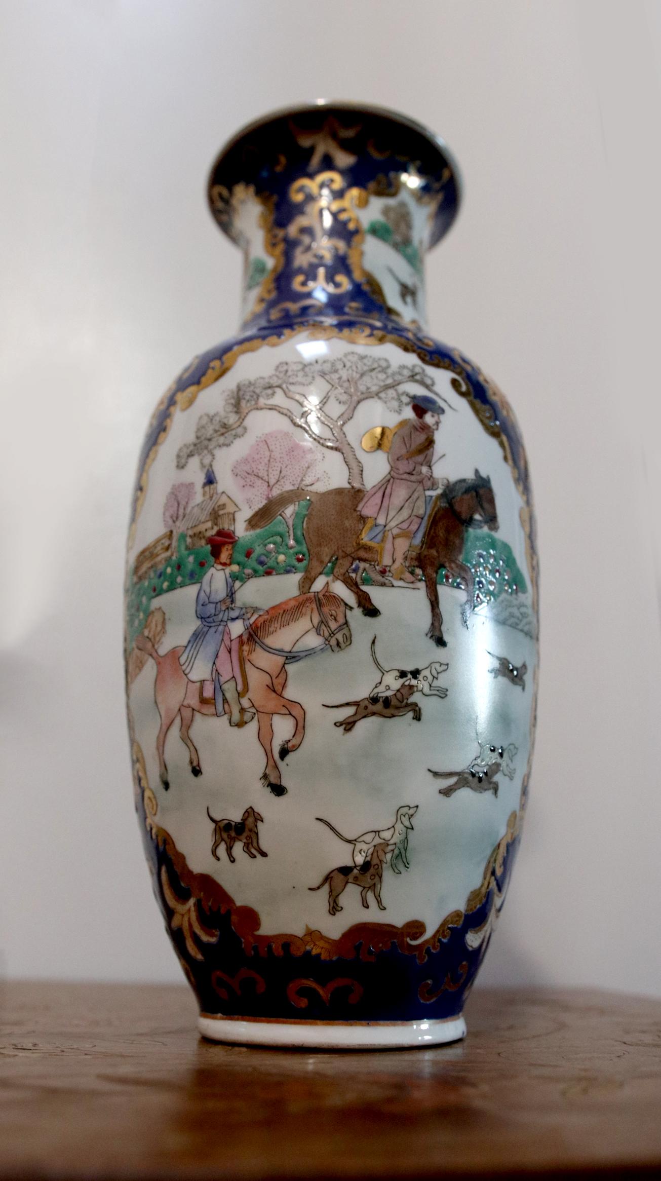 The hunting scene with Asian characters and hunting dogs are one of the compelling subjects of this vase. The detail includes several dogs of different breeds. The vase is a mid to late 20th century Baluster Vase or a meiping vase. It is