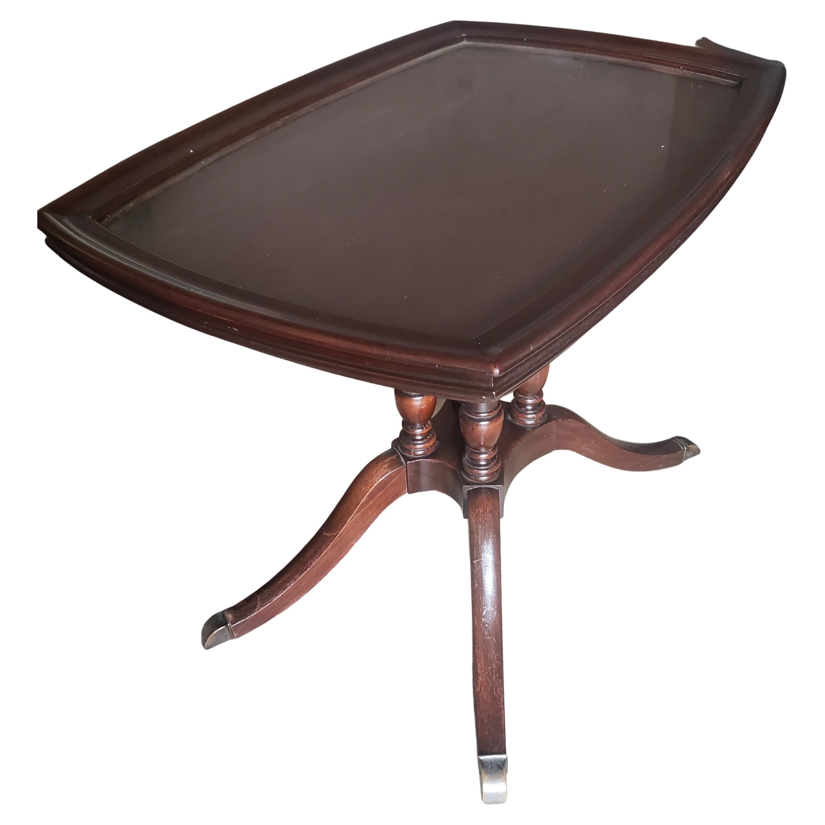 A 1940s Brandt Furniture Mahogany Side Table with Glass Tray. Features a quadpod pedestal terminating with 4 brass paw feet.
