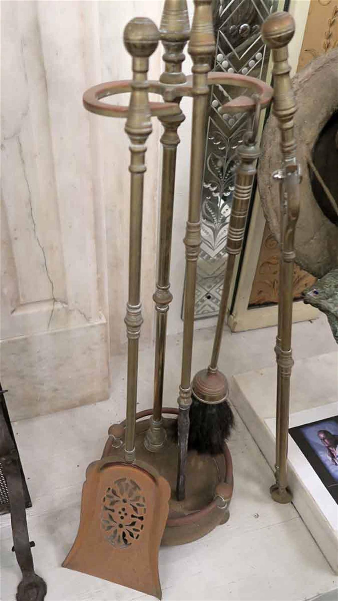 Traditional 1940s five-piece brass antique fireplace tool set. This can be seen at our Broadway location on the upper west side in Manhattan.