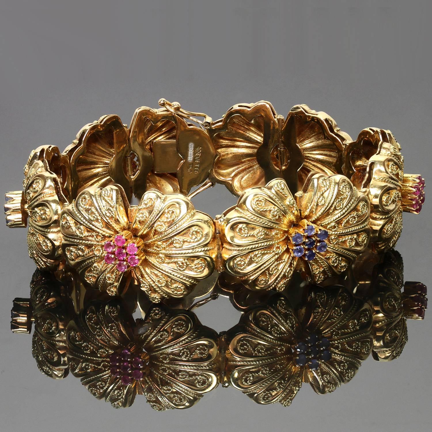 This fabulous antique Brevetto bracelet features six ornate links crafted in 18k yellow gold and beautifully prong-set with round faceted rubies and sapphires. Made in Italy circa 1940s. Measurements: 0.90